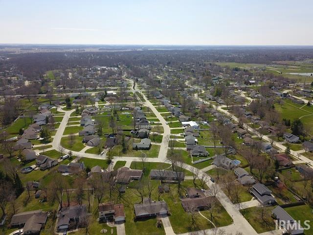 Aerial overview of property's location with nearby suburban area