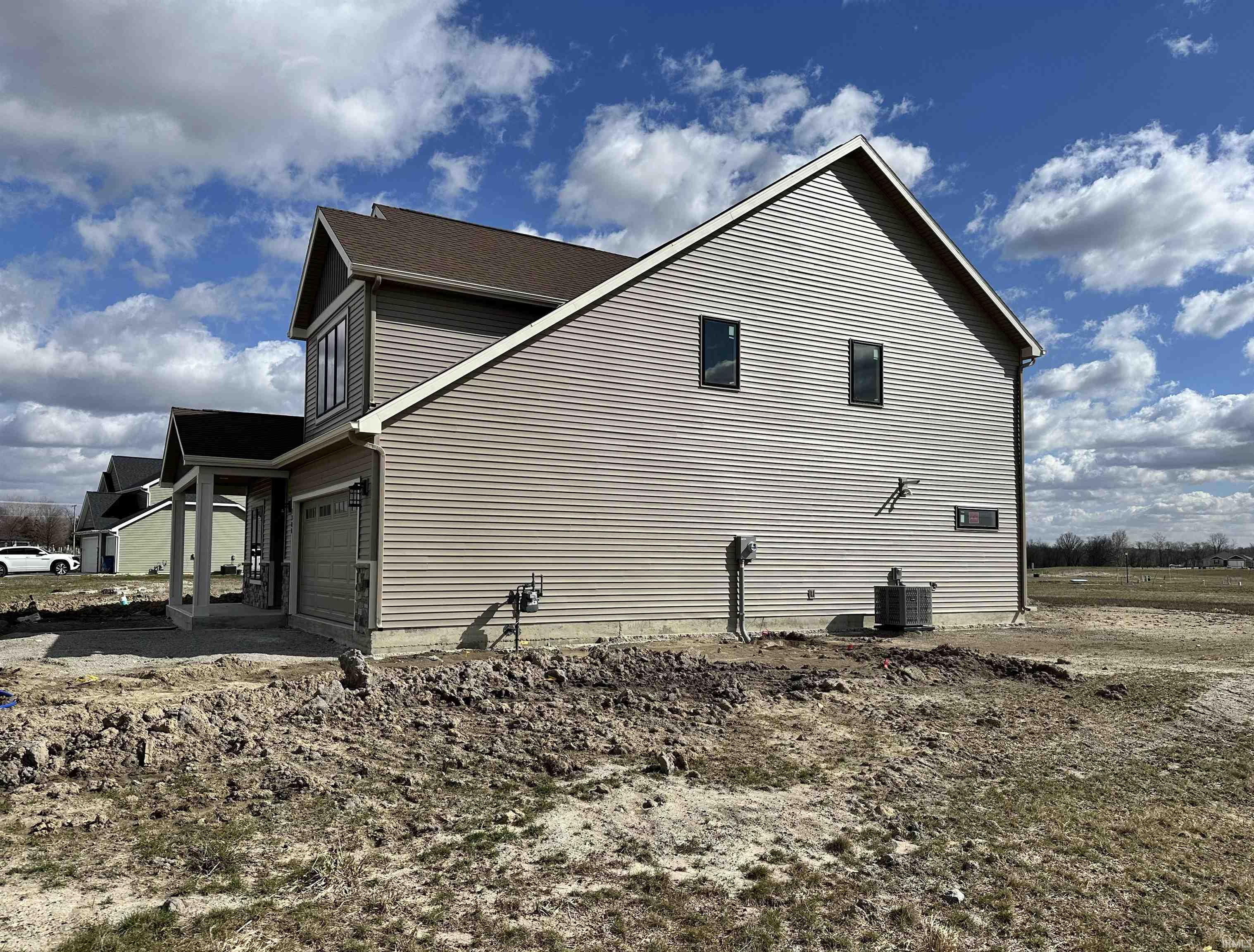 View of home's exterior featuring a cooling unit