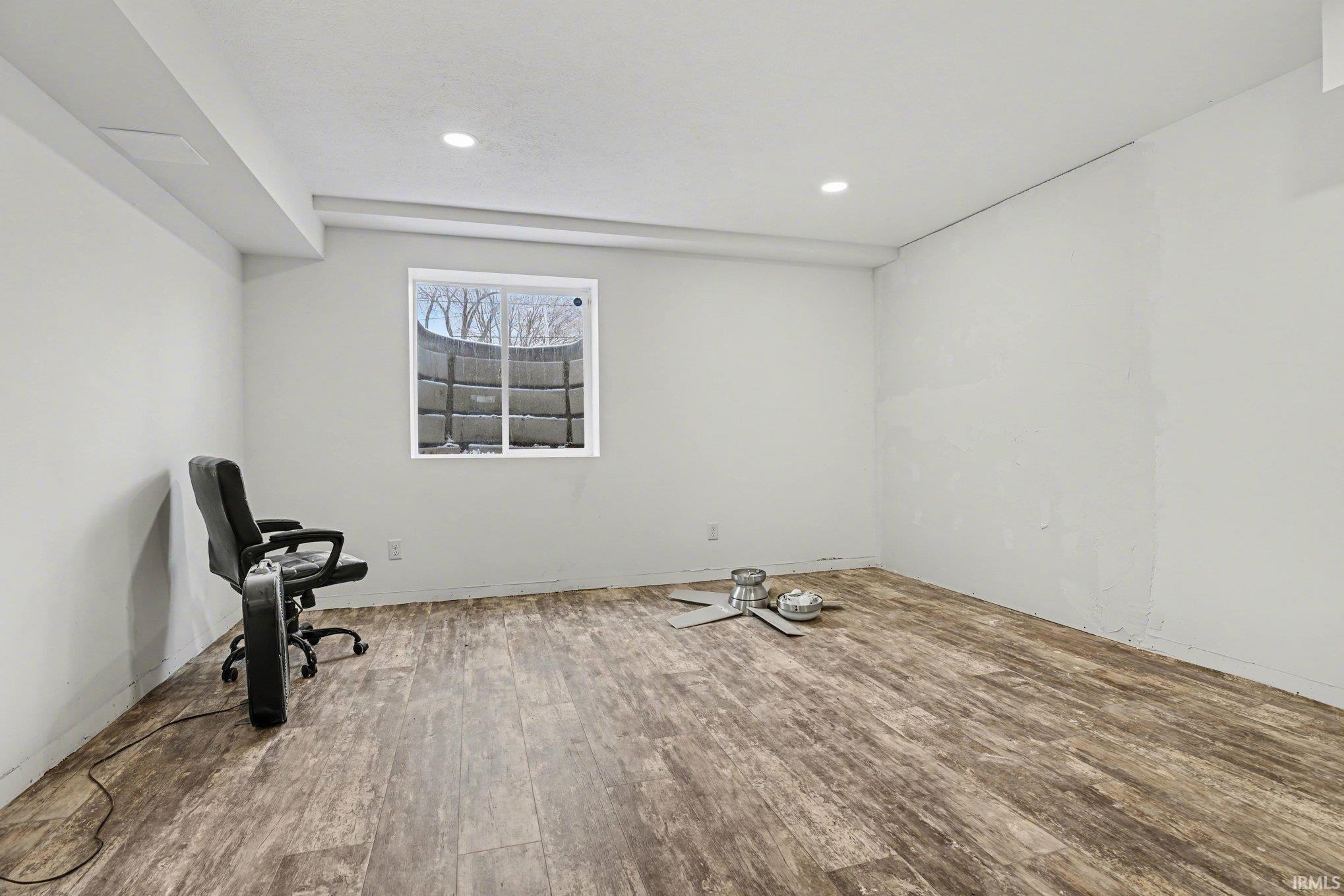 Unfurnished room featuring wood-type flooring