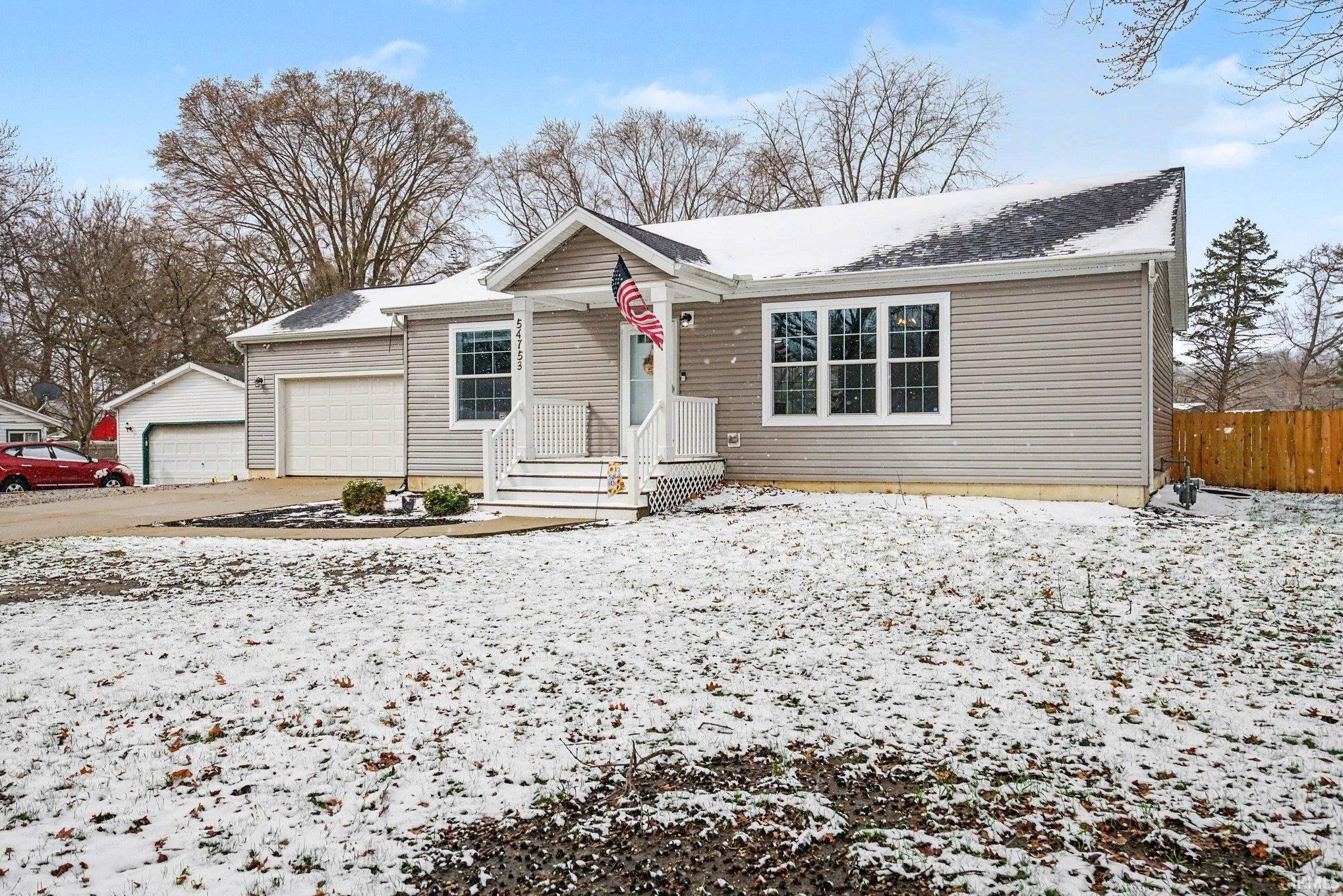Single story home featuring an attached garage