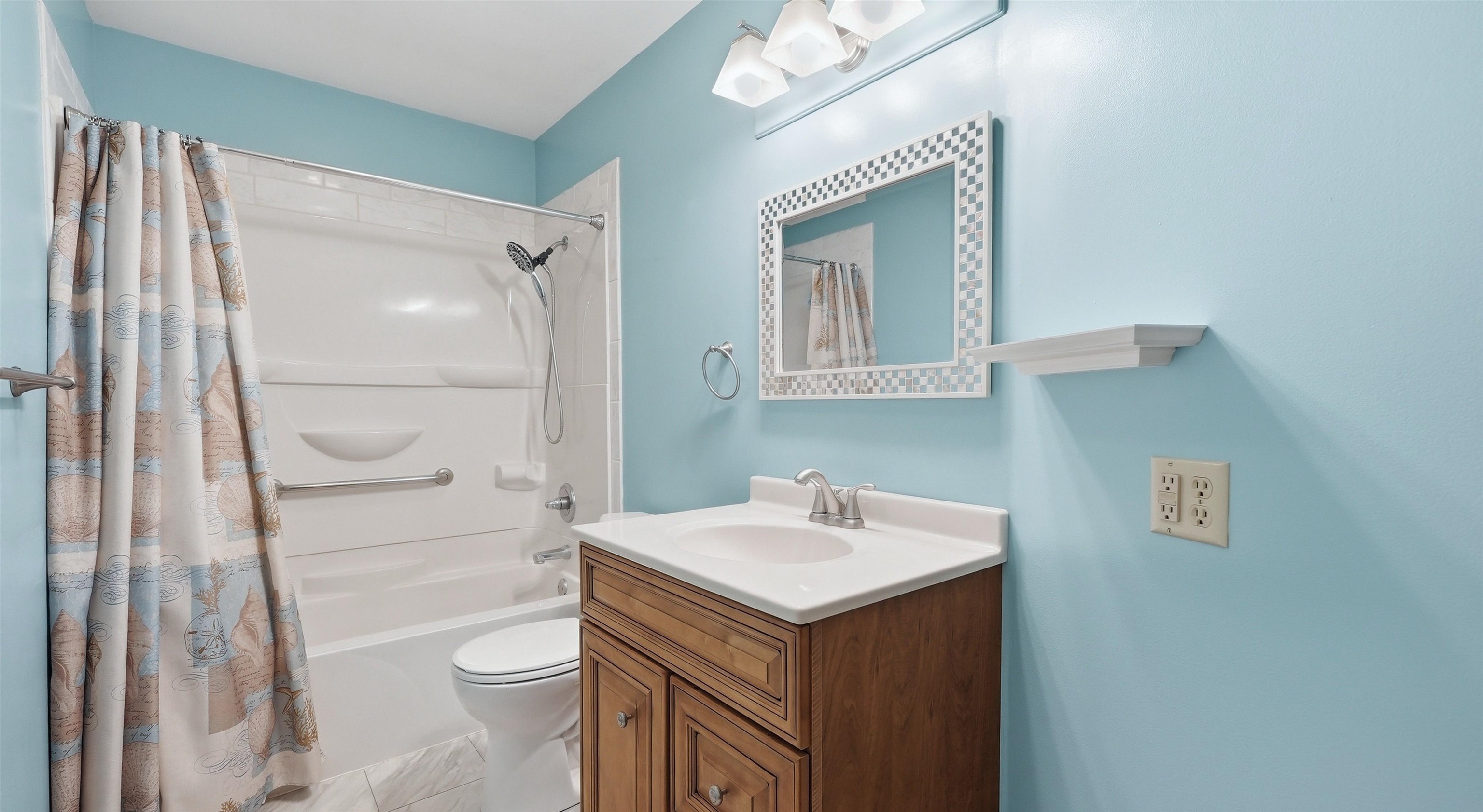 Full bathroom with vanity and shower / bath combo