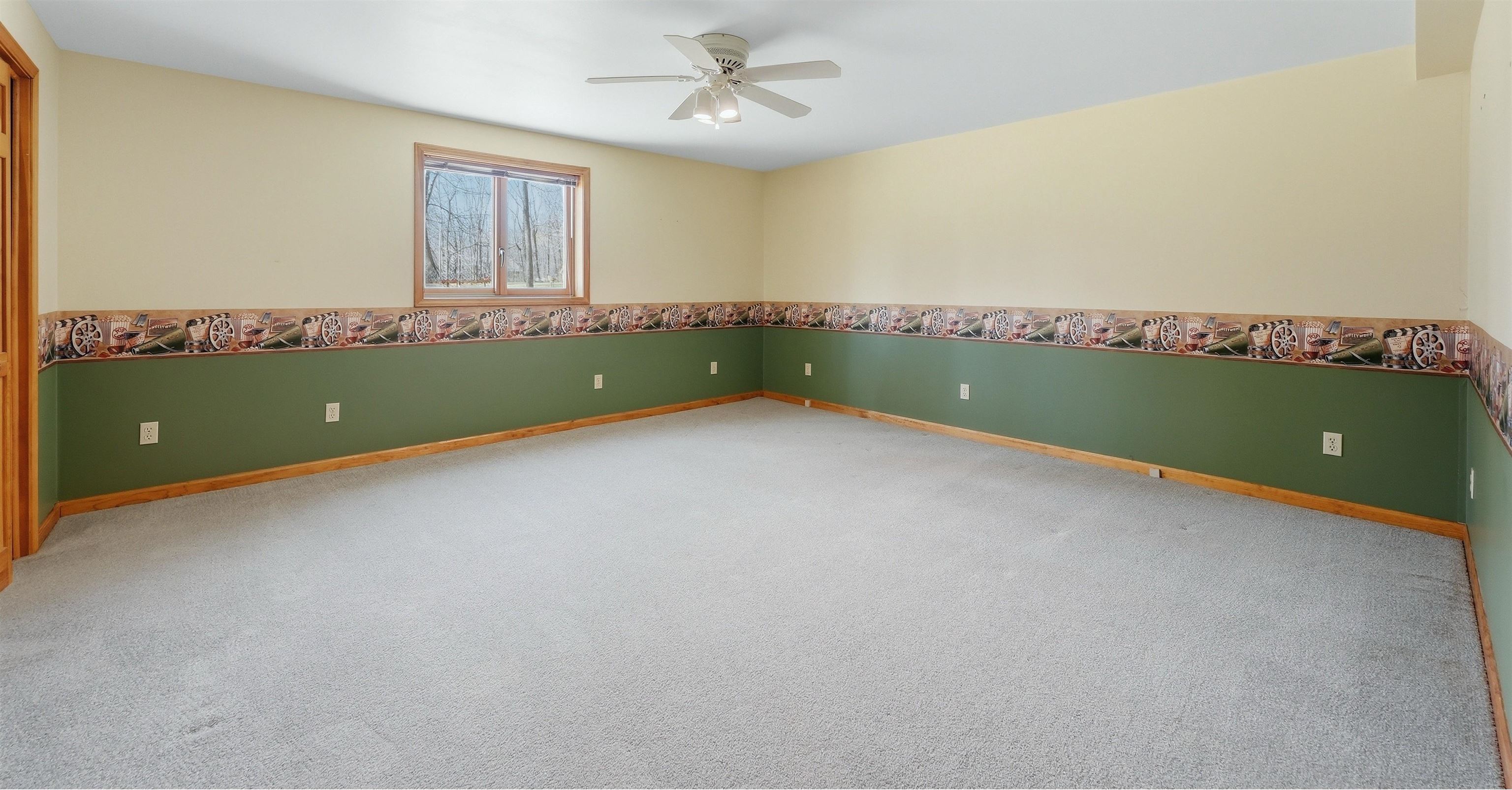 bedroom with light carpet and large window for lots of light