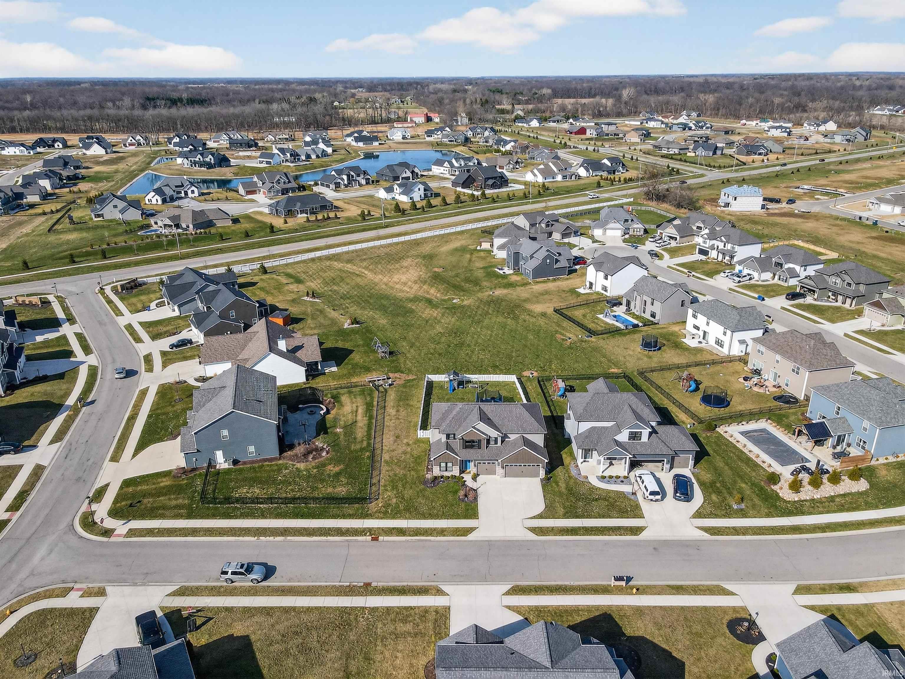 Aerial overview of property's location with nearby suburban area