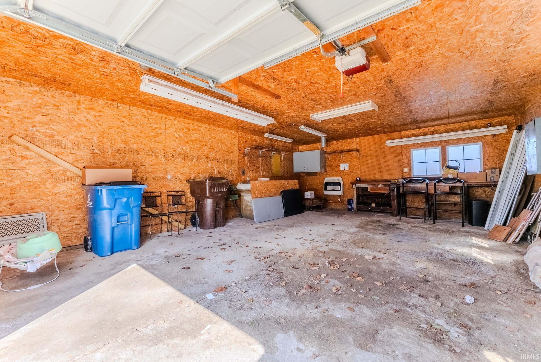 Garage featuring garage door opener