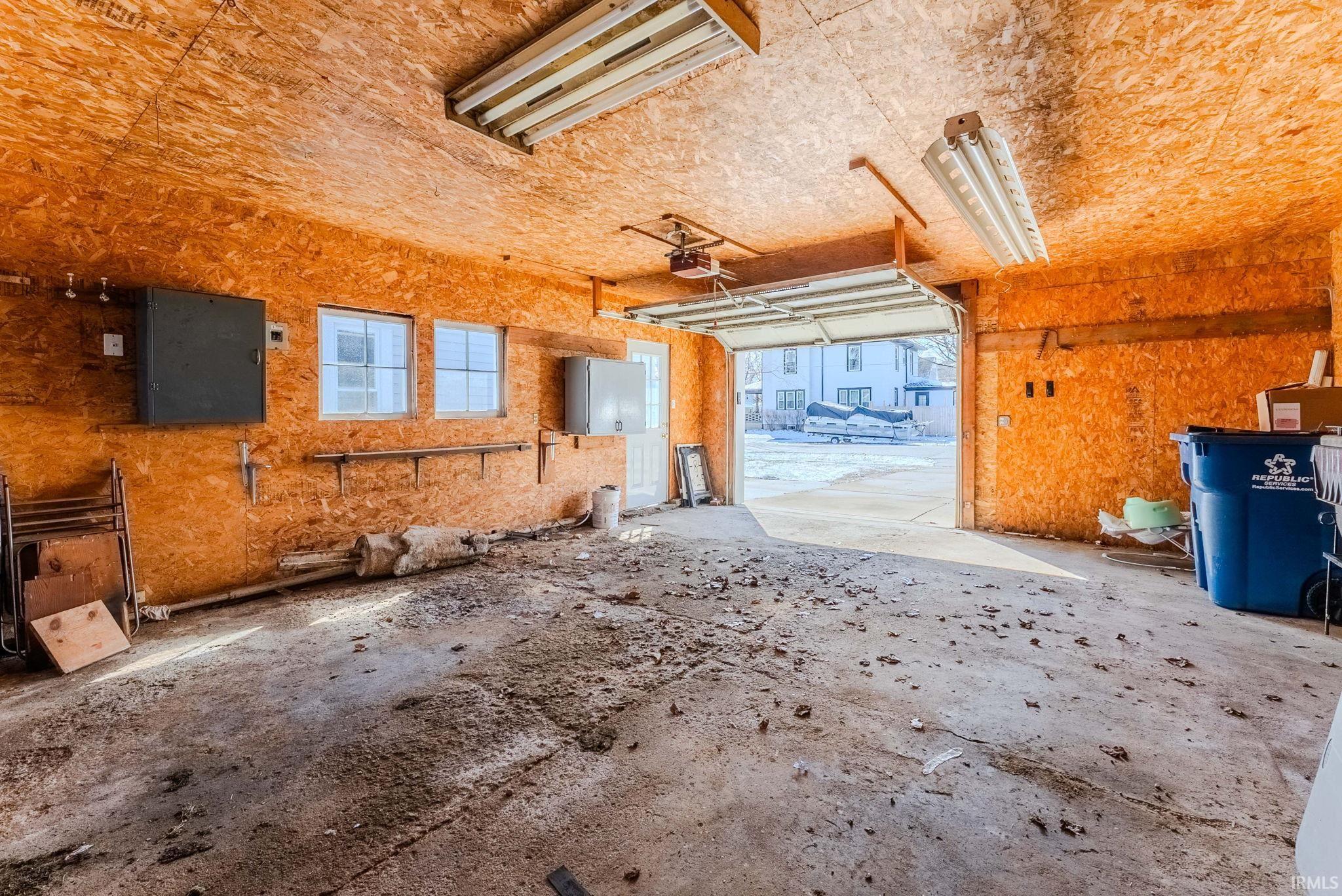 Garage featuring a garage door opener
