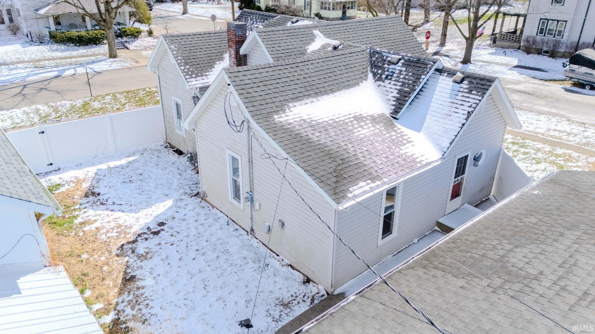 Snowy aerial view with a residential view