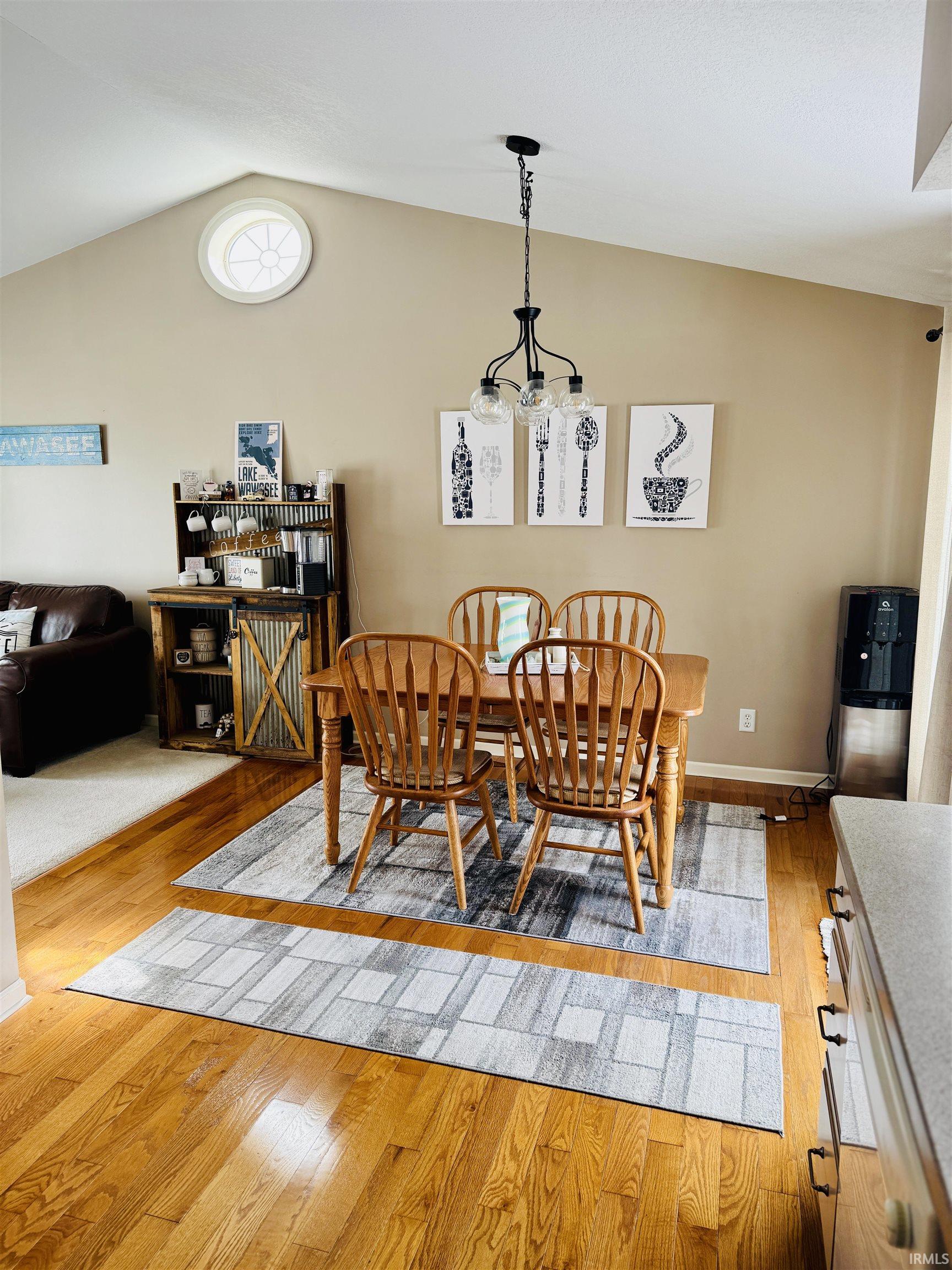 Dining space featuring light wood-type flooring and baseboards