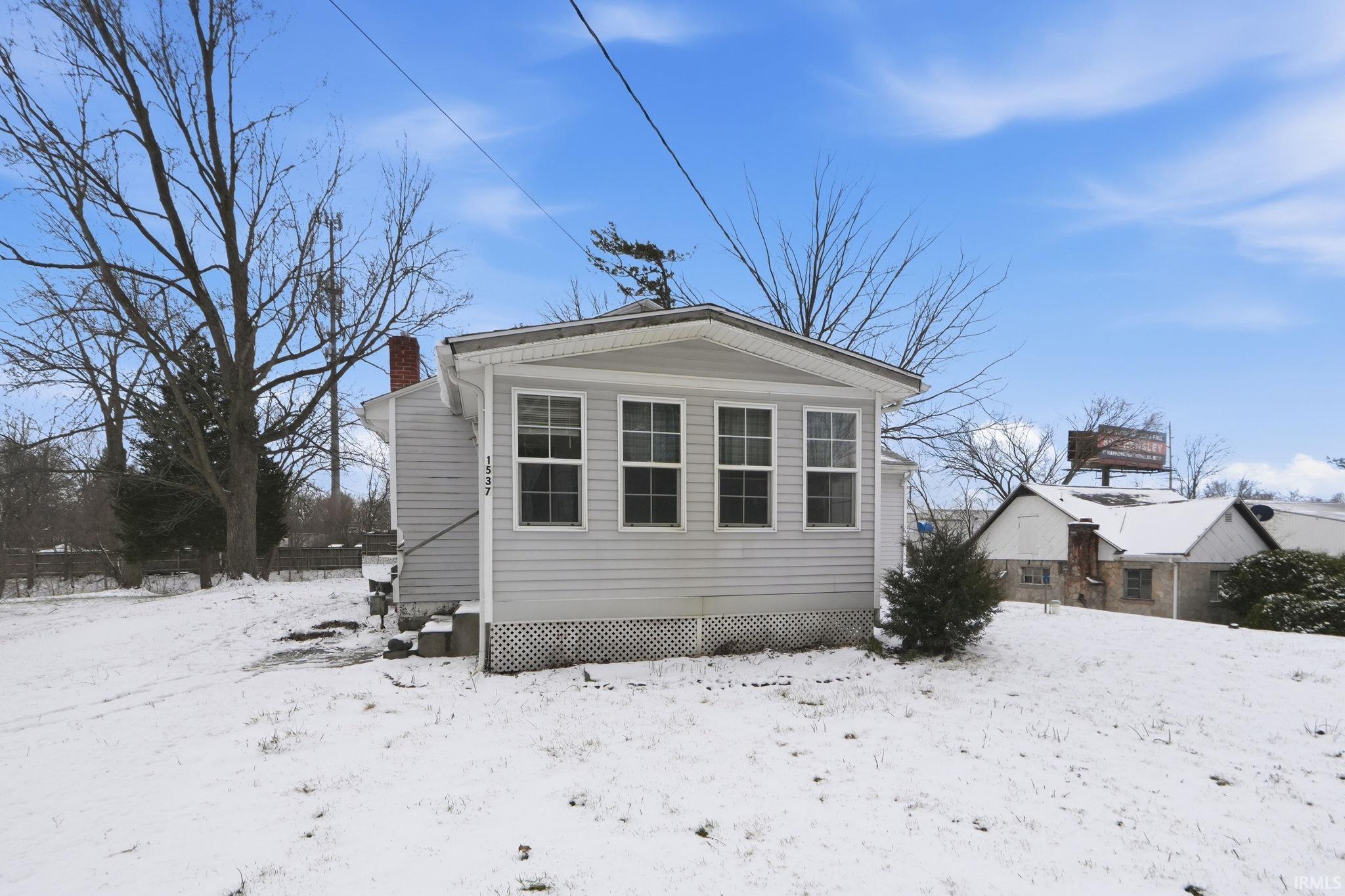 View of front of home with a chimney