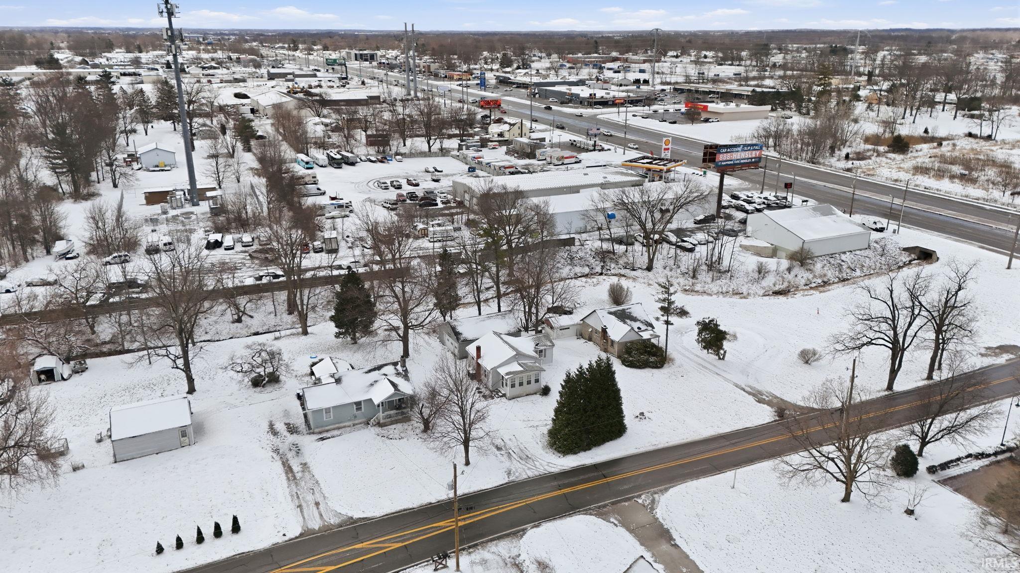 Snowy aerial view featuring a residential view