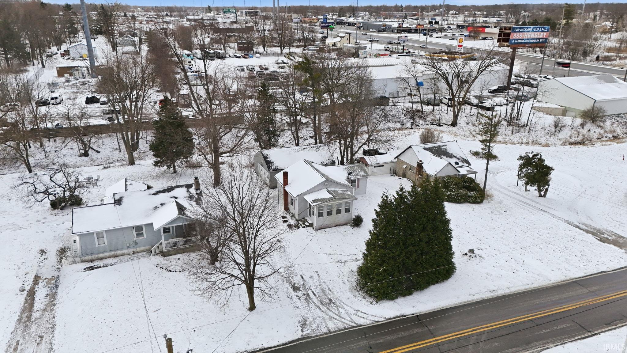 Snowy aerial view featuring a residential view