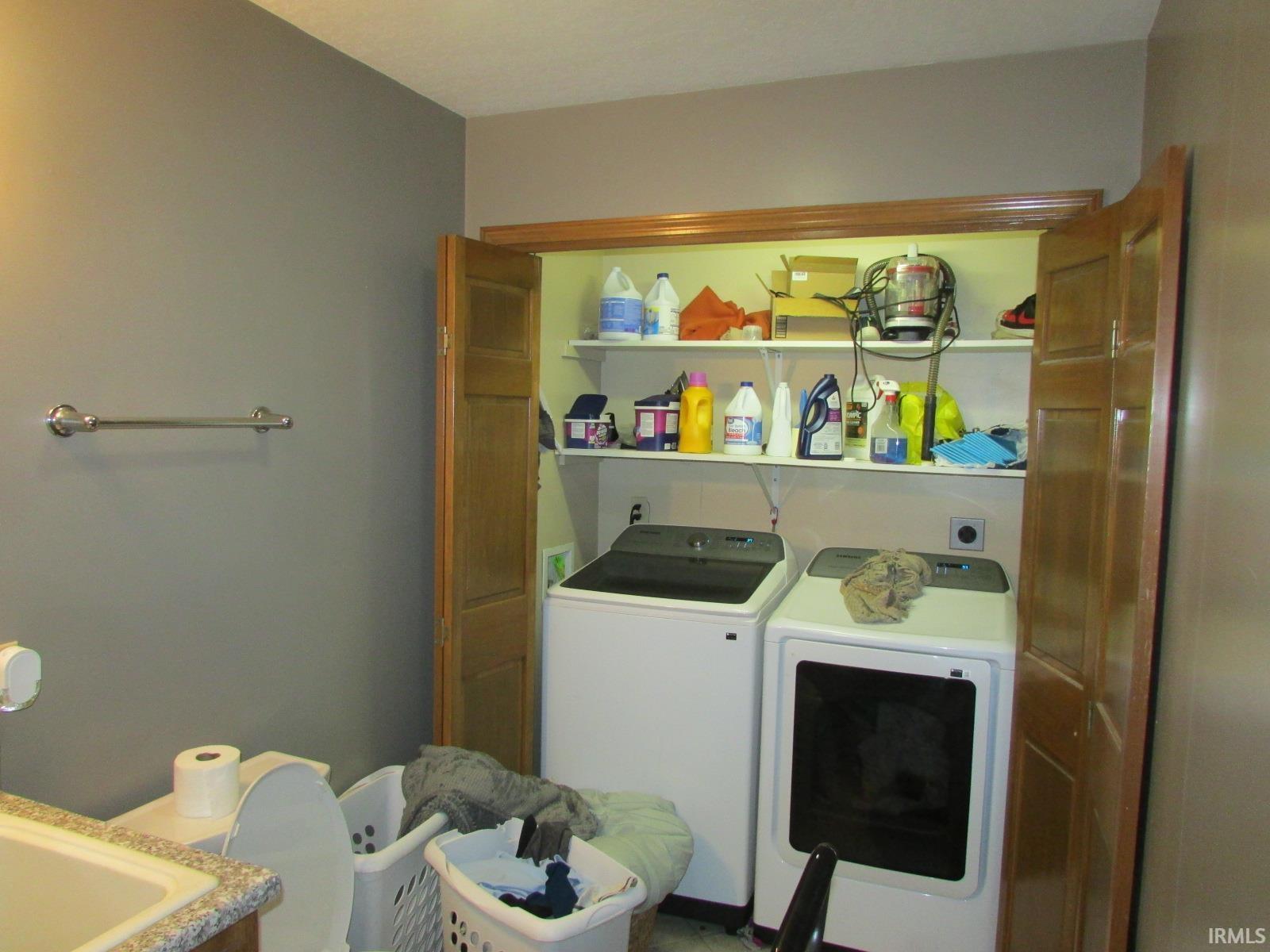 Laundry area with washing machine and clothes dryer