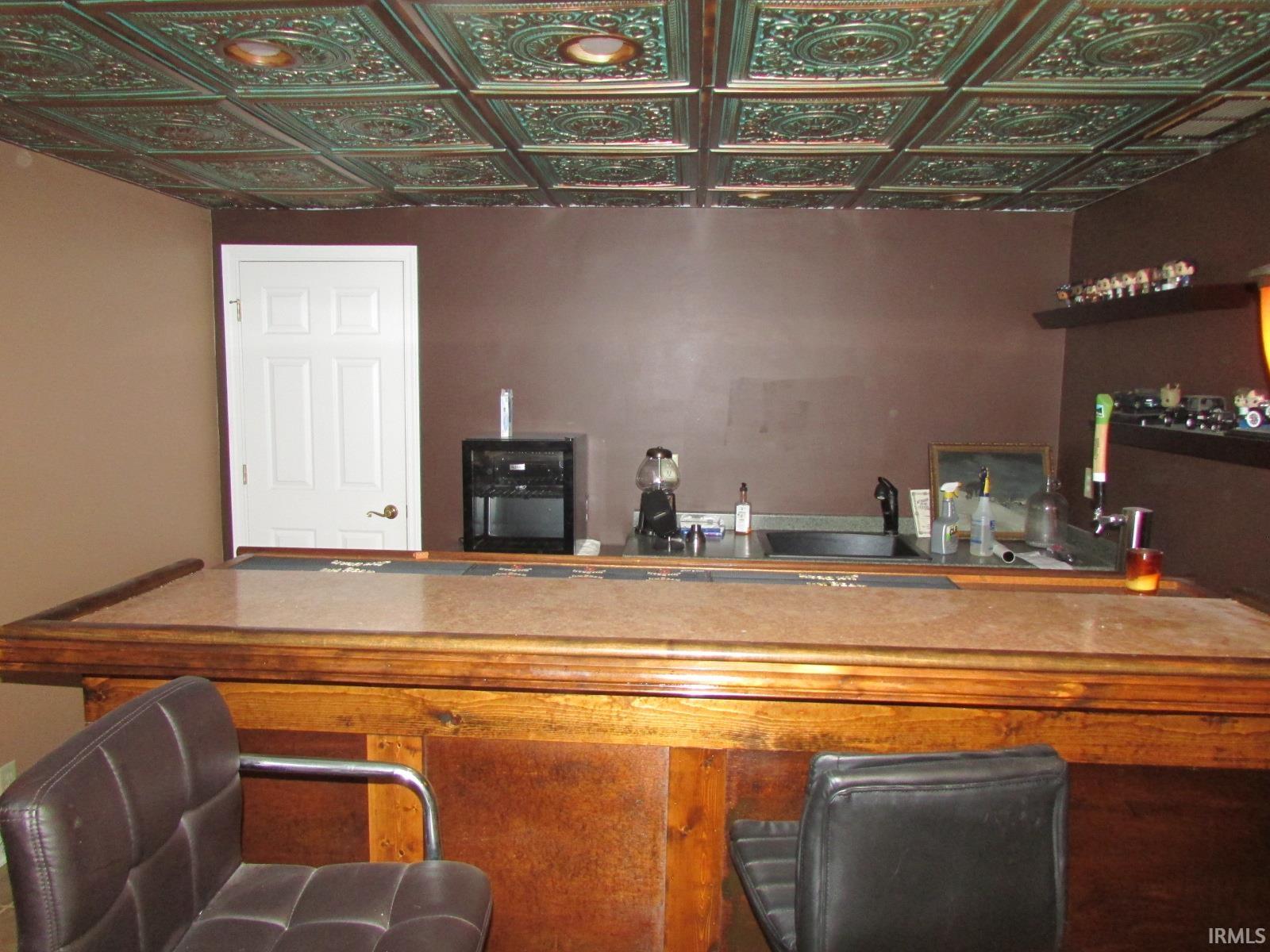 Indoor bar with an ornate ceiling