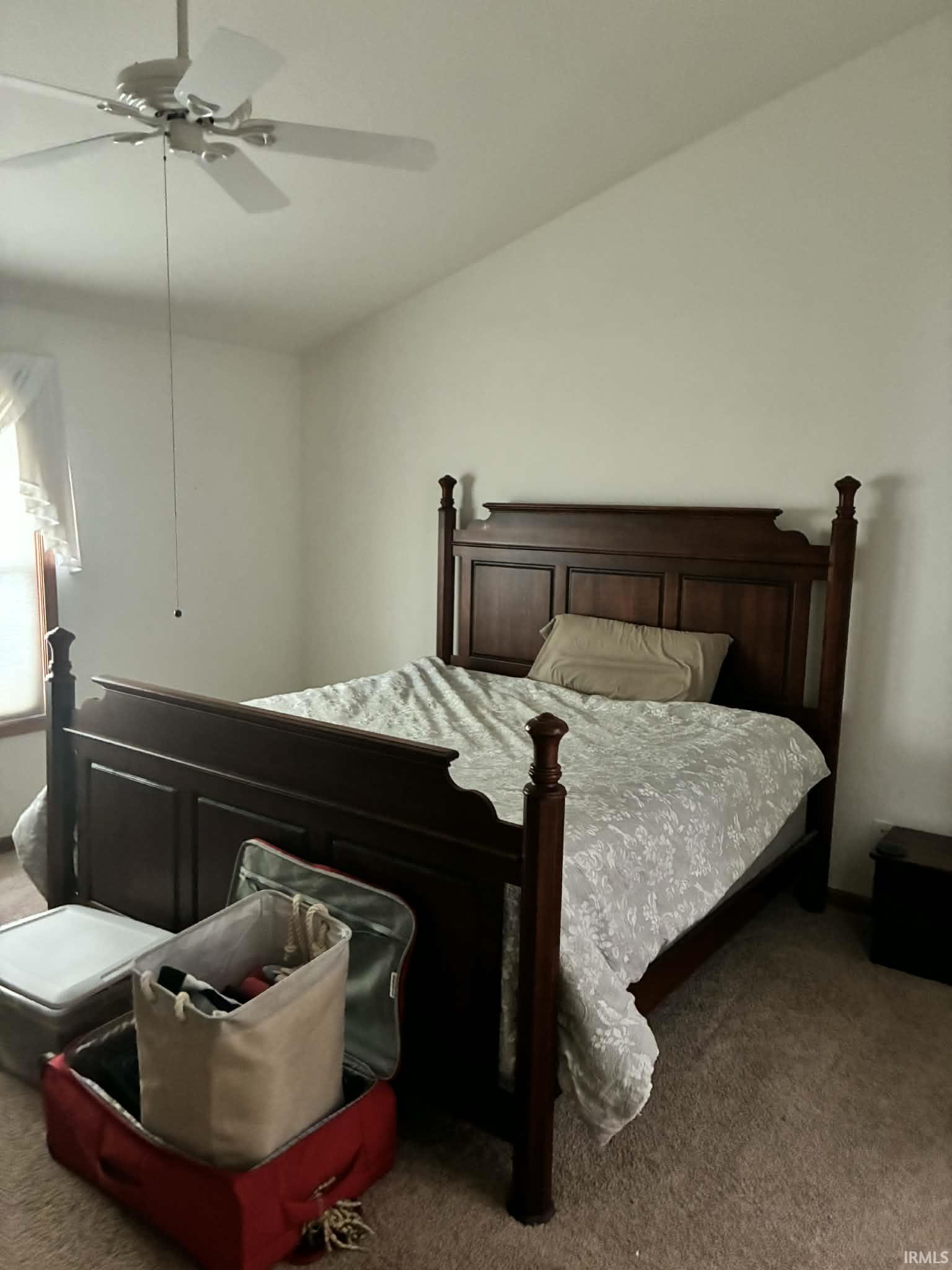 Bedroom with carpet flooring and ceiling fan