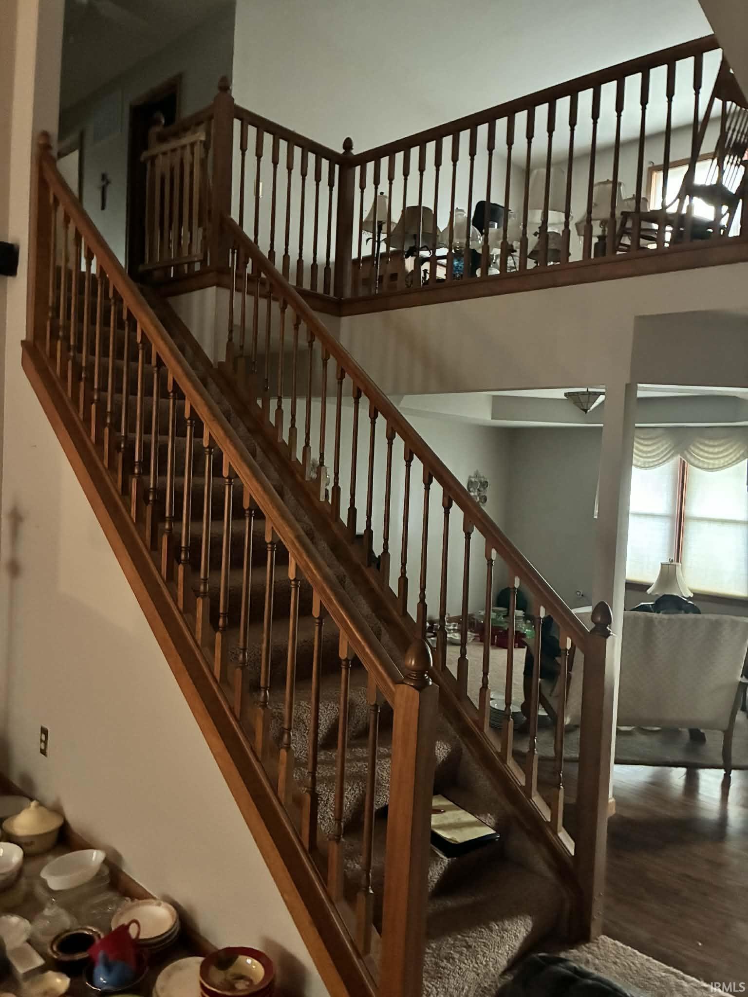 Stairway featuring a high ceiling