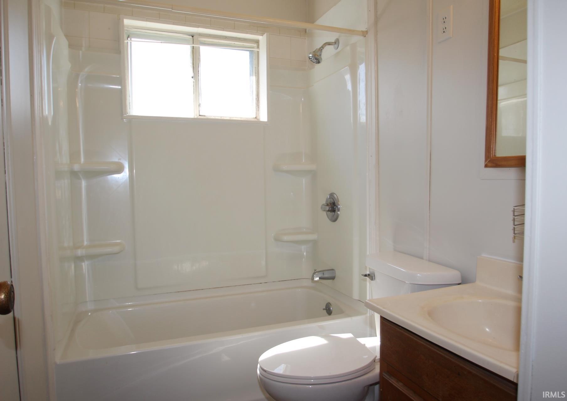 Full bathroom with vanity and shower / bathtub combination