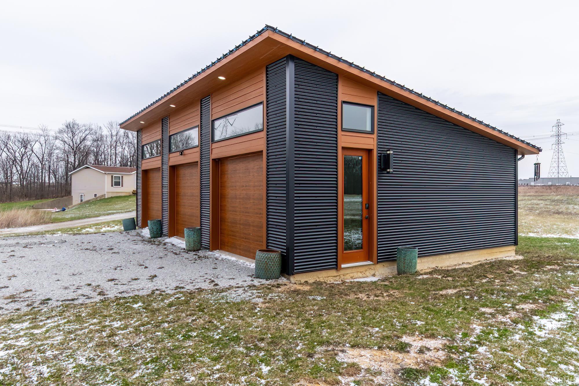 View of side of home featuring a garage