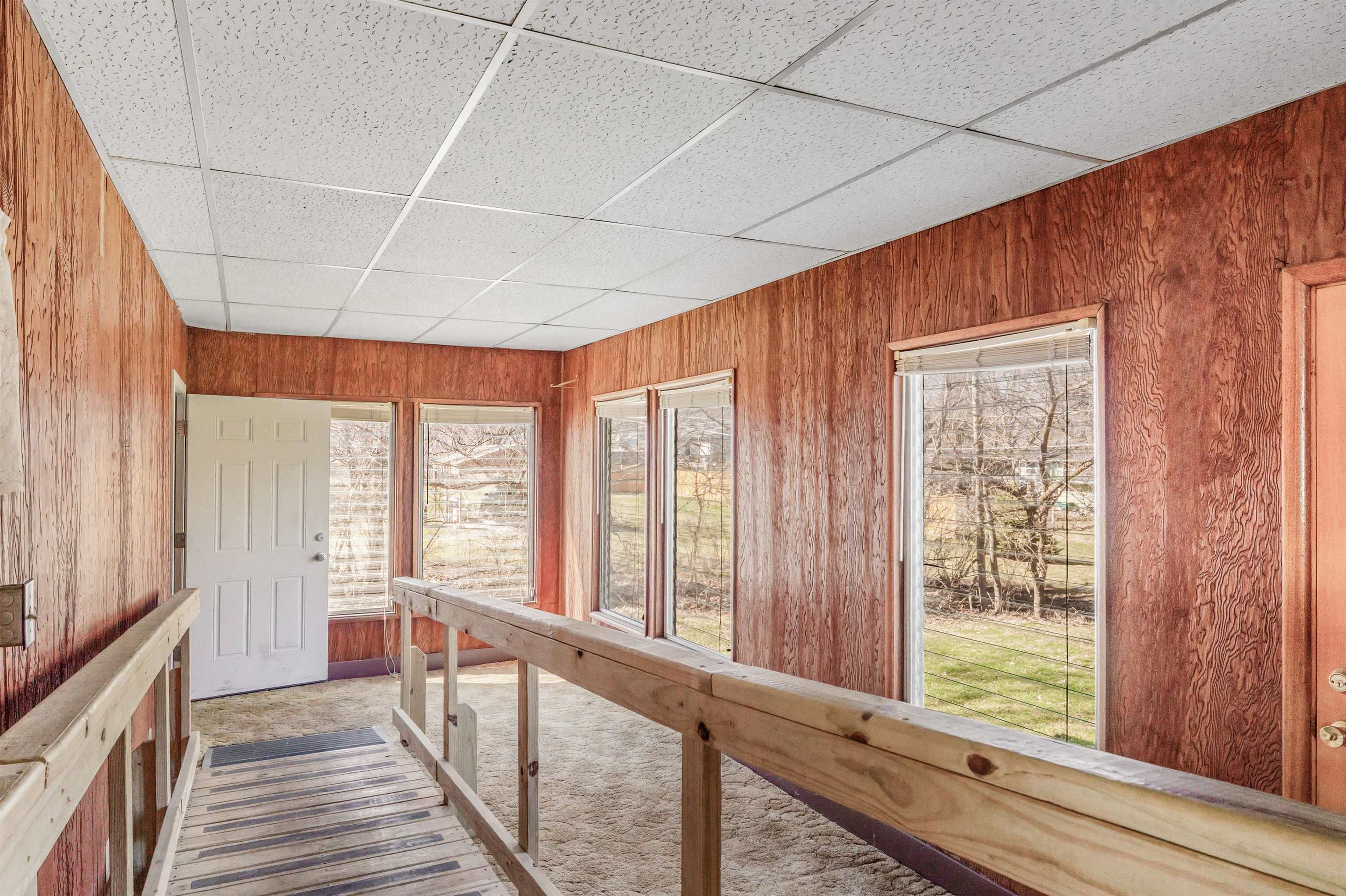 Unfurnished sunroom featuring plenty of natural light