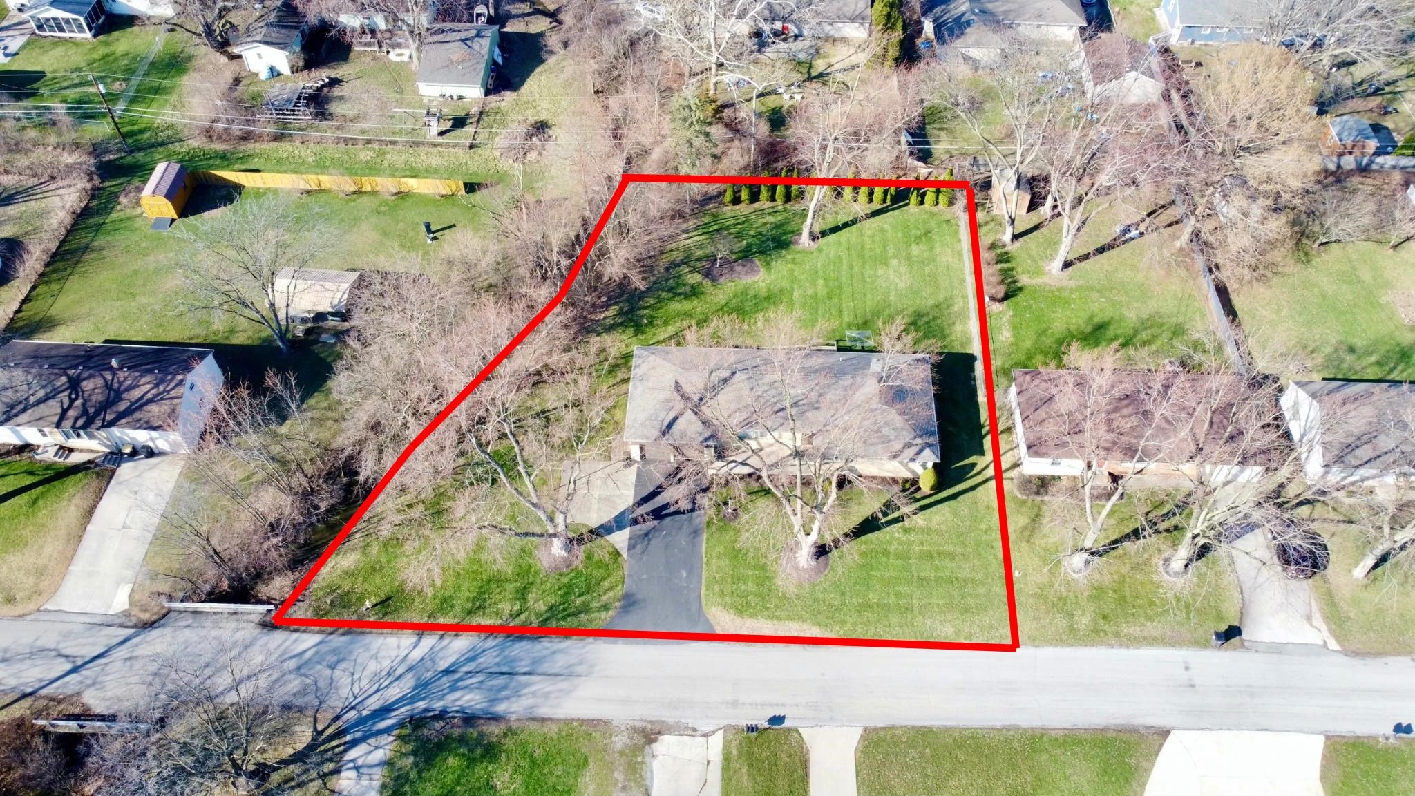 Aerial view of property and surrounding area with property boundaries highlighted