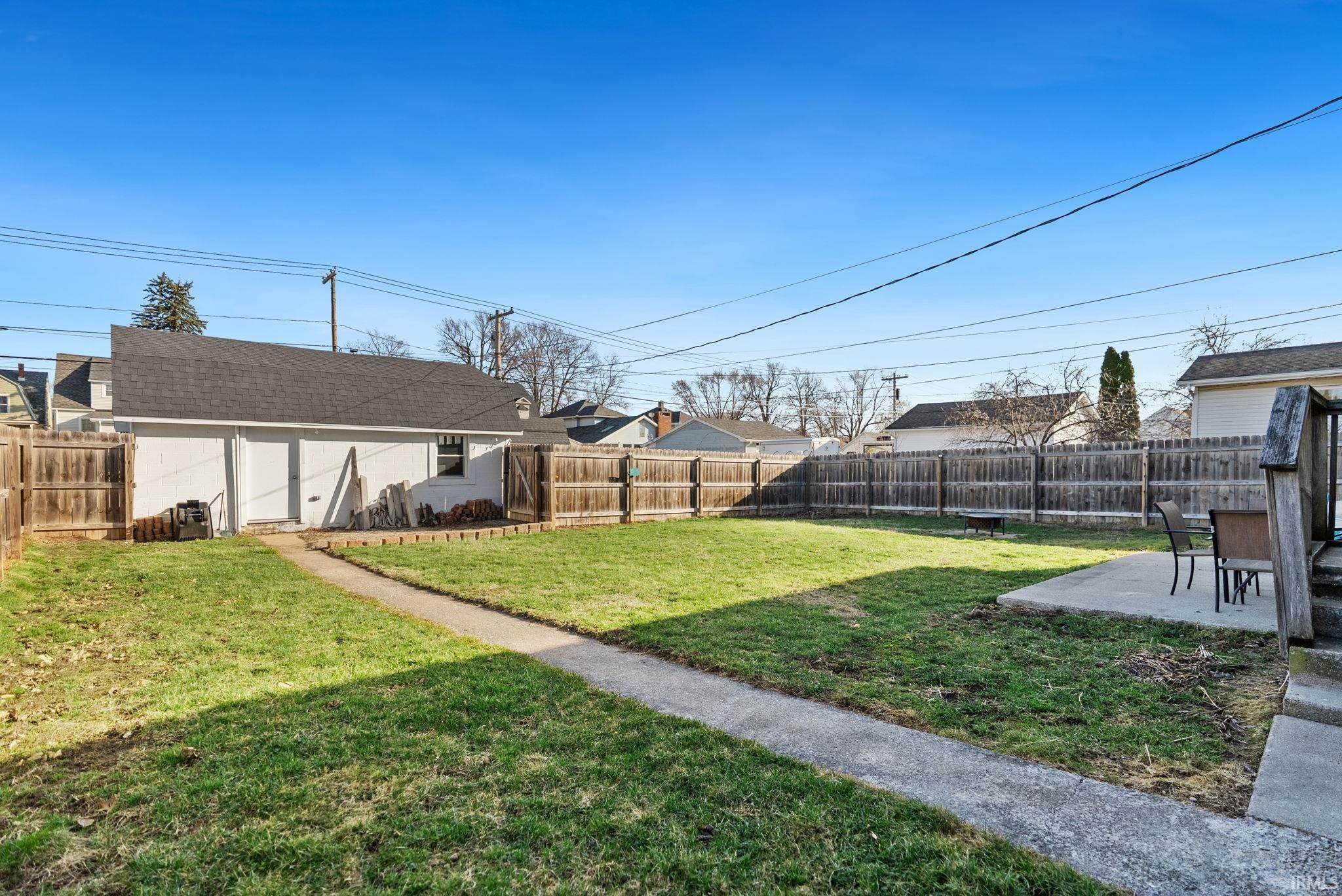 Fenced backyard featuring a patio area