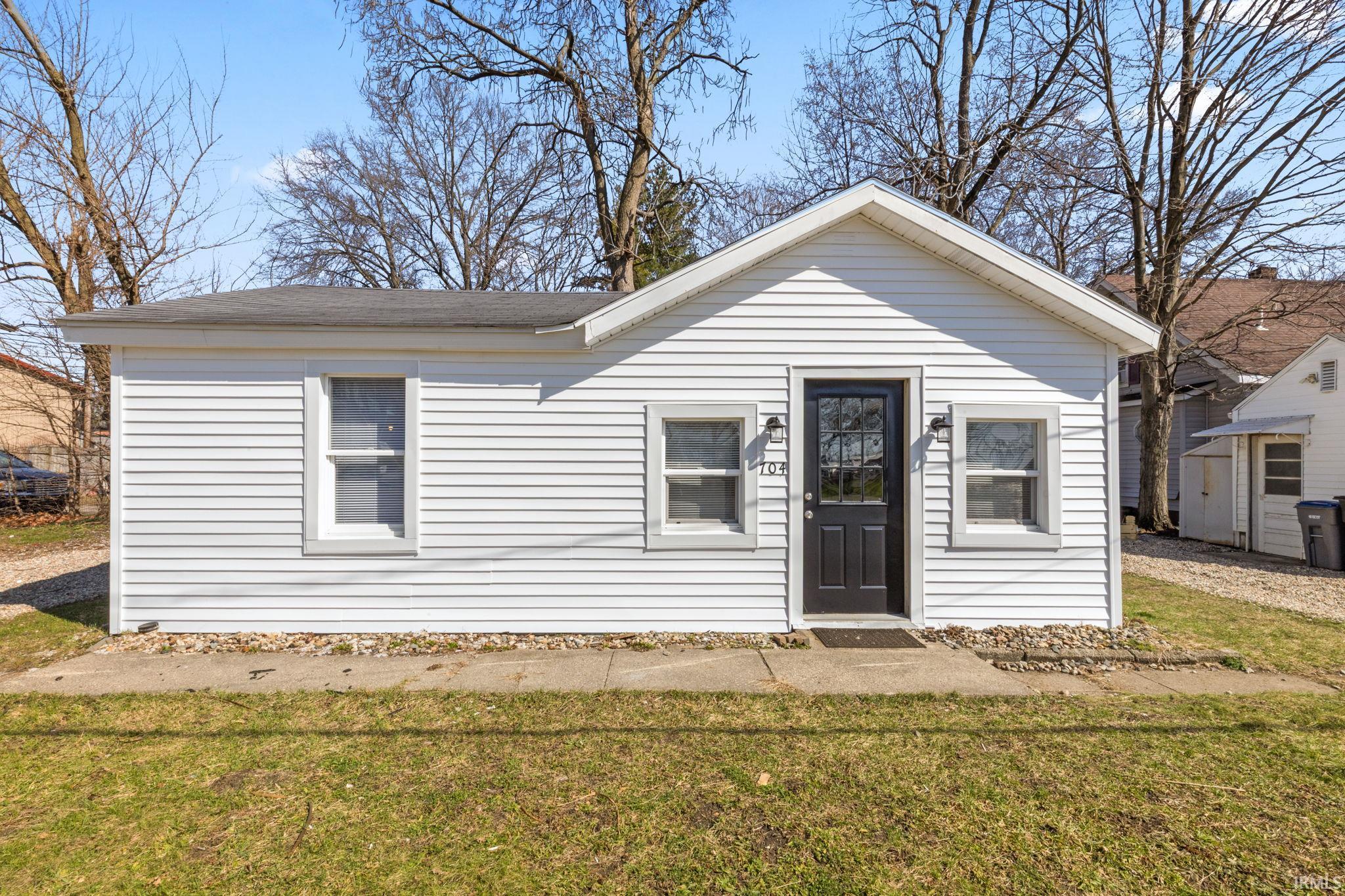 View of front of house with a front lawn