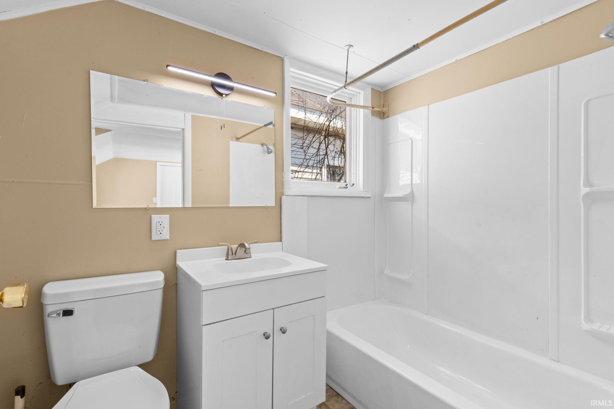 Full bathroom with vanity and shower / tub combination