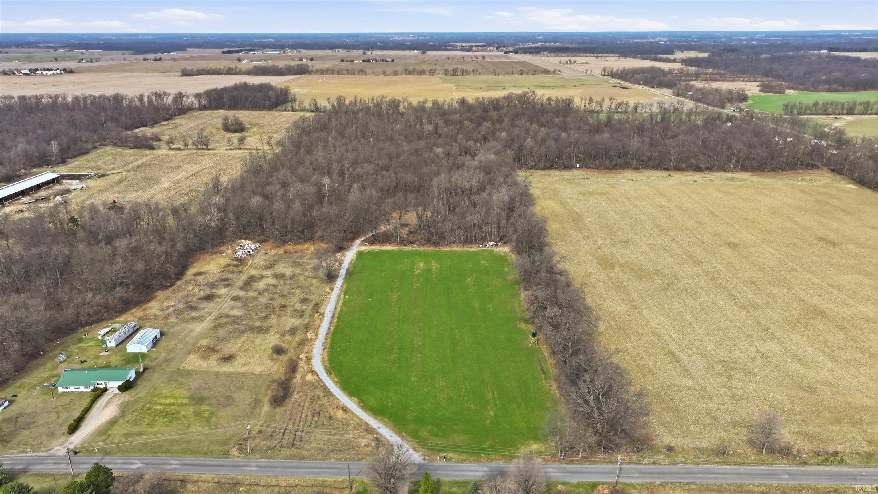 View of rural area featuring rows of crops