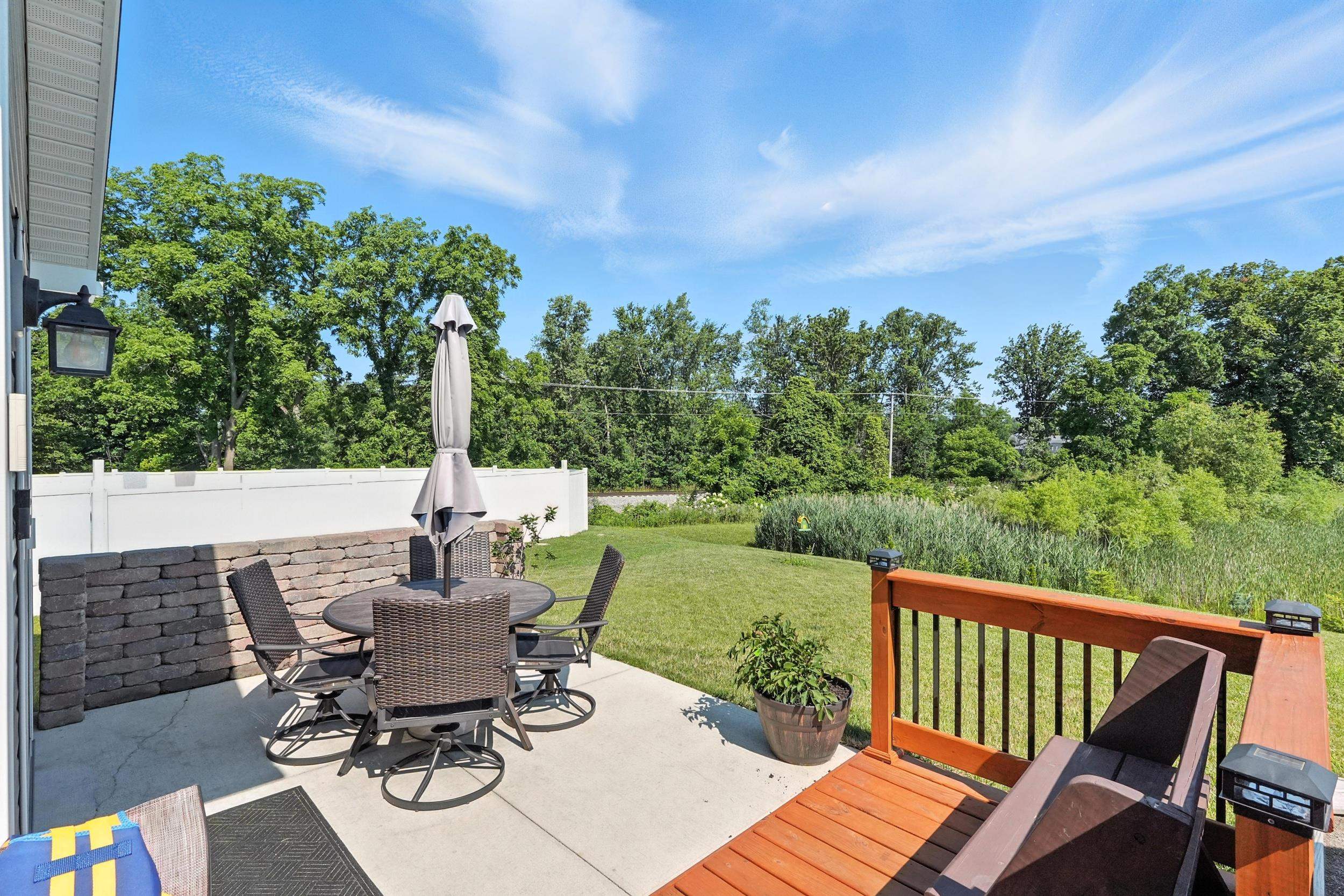 View of patio / terrace featuring outdoor dining space and a wooden deck