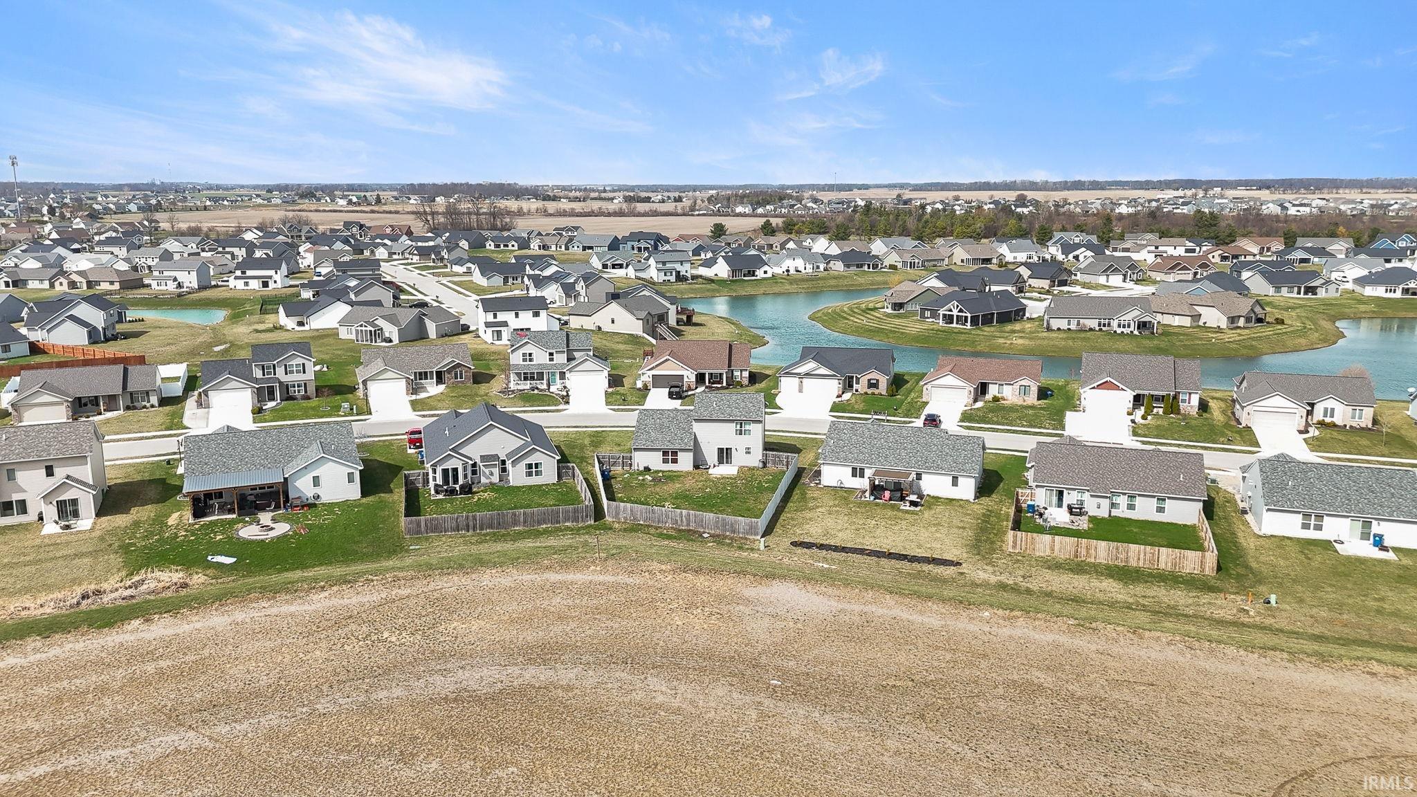 Aerial view of residential area with a large body of water