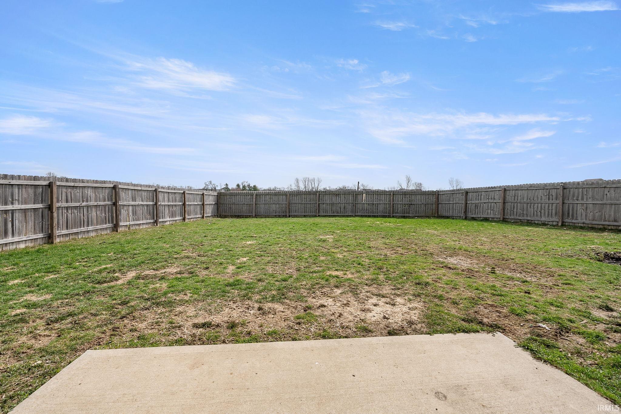 View of fenced backyard