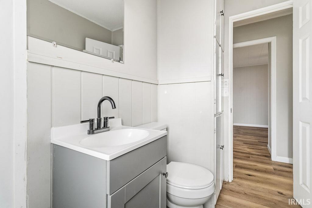 Bathroom with vanity and light wood-style flooring