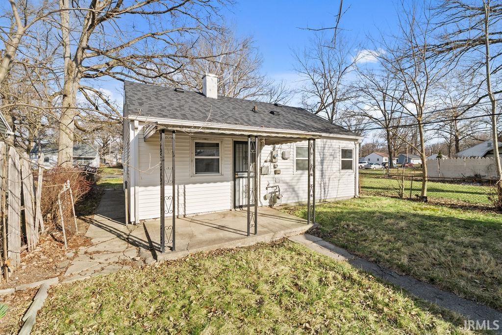 View of outdoor structure featuring a fenced backyard