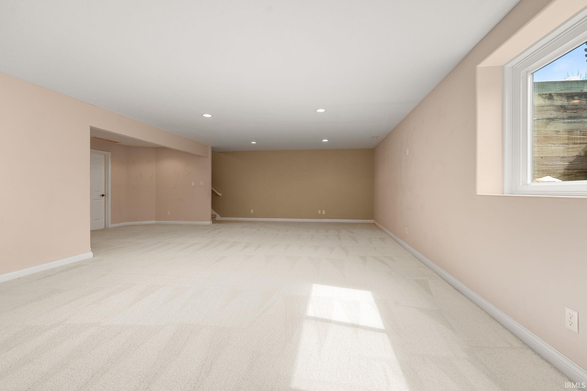 Unfurnished room featuring light colored carpet and recessed lighting