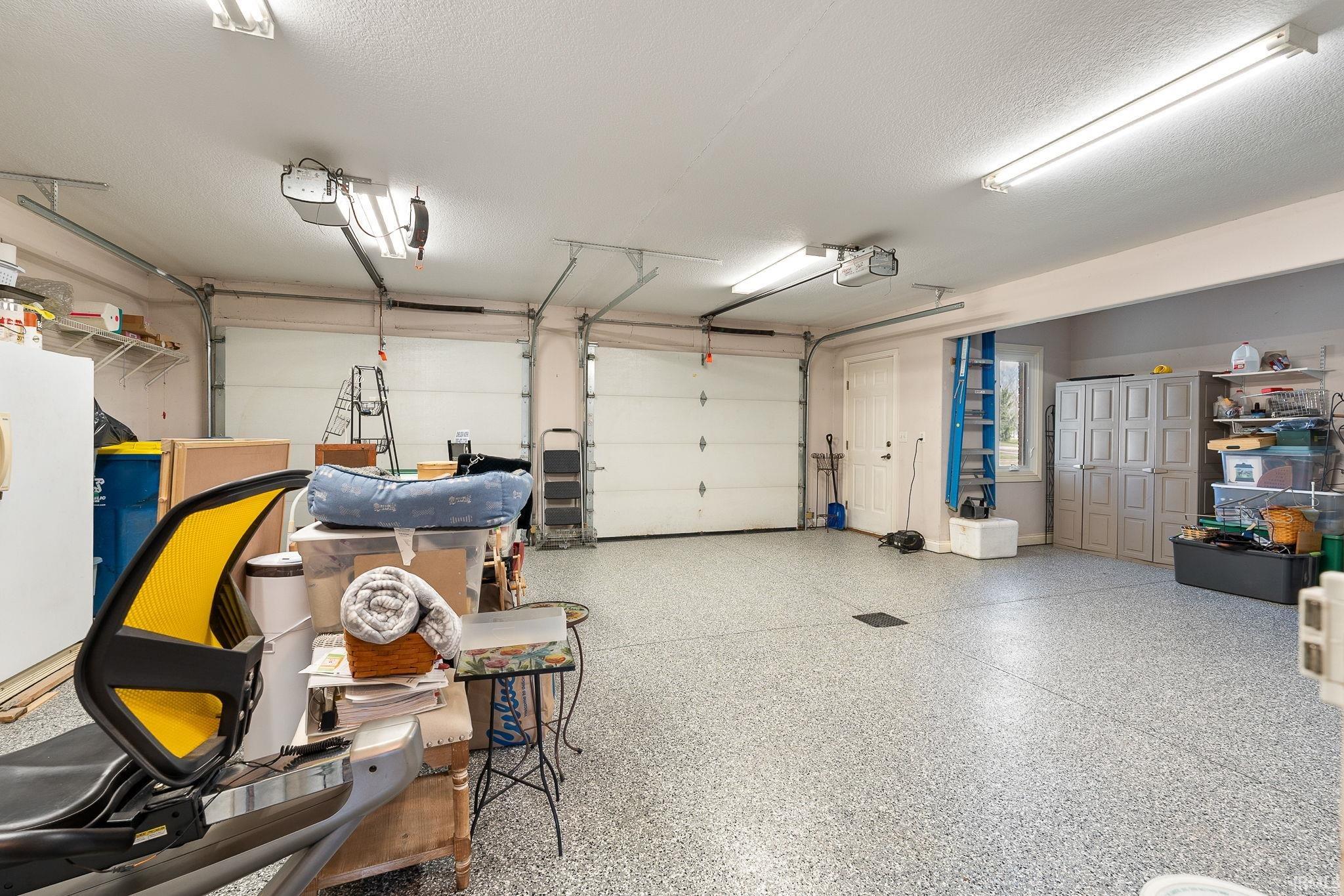 Garage featuring a garage door opener