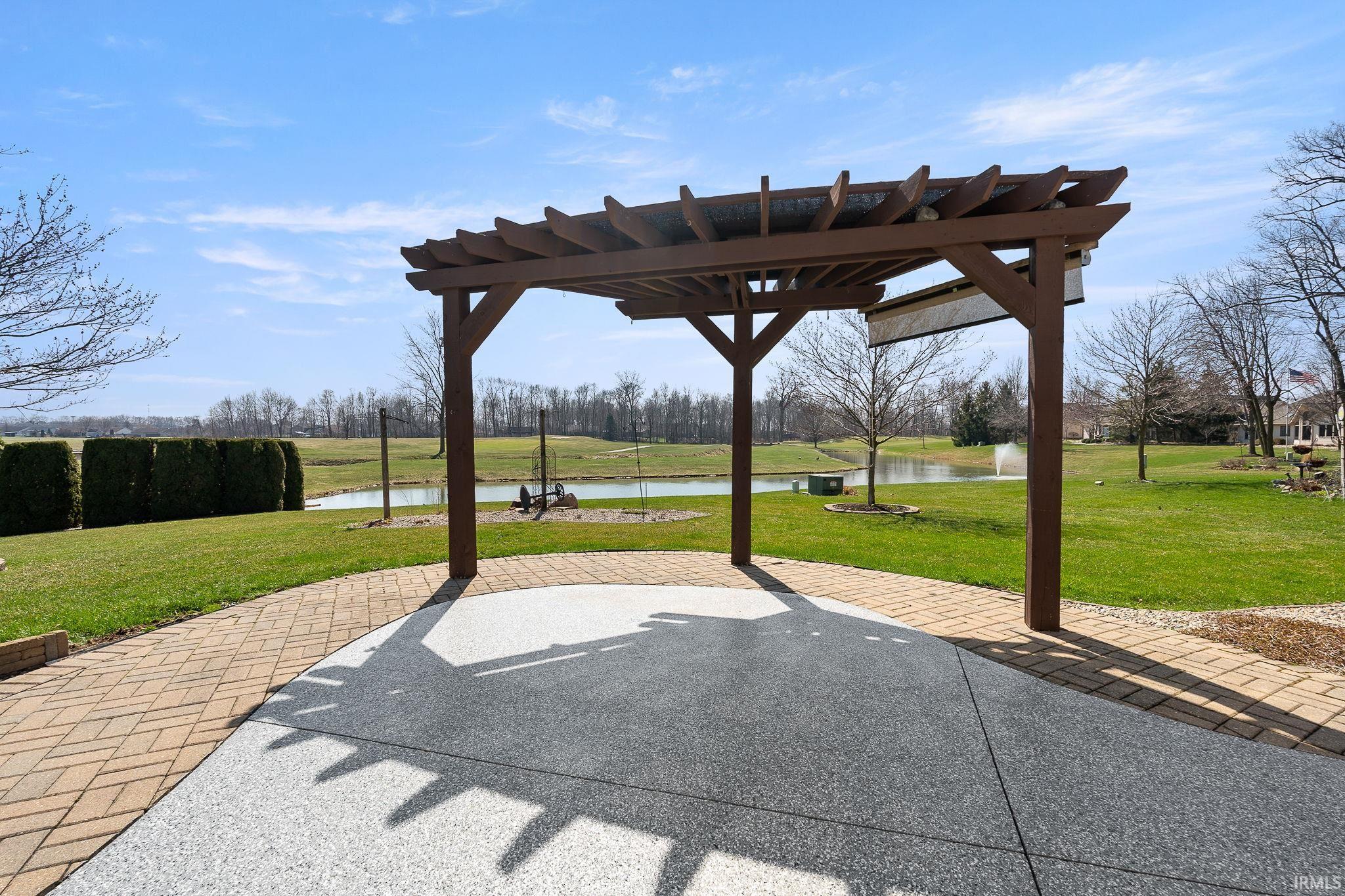 View of patio / terrace featuring a water view and a pergola