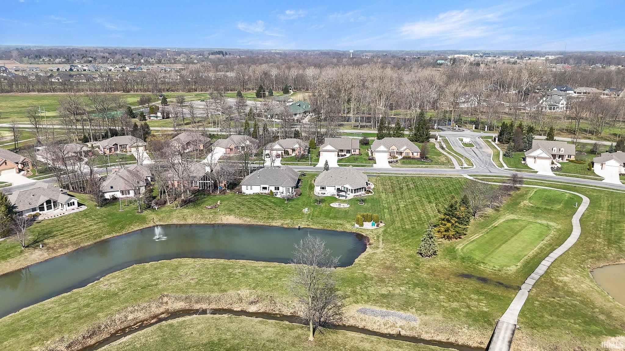View of property location with nearby suburban area and a nearby body of water