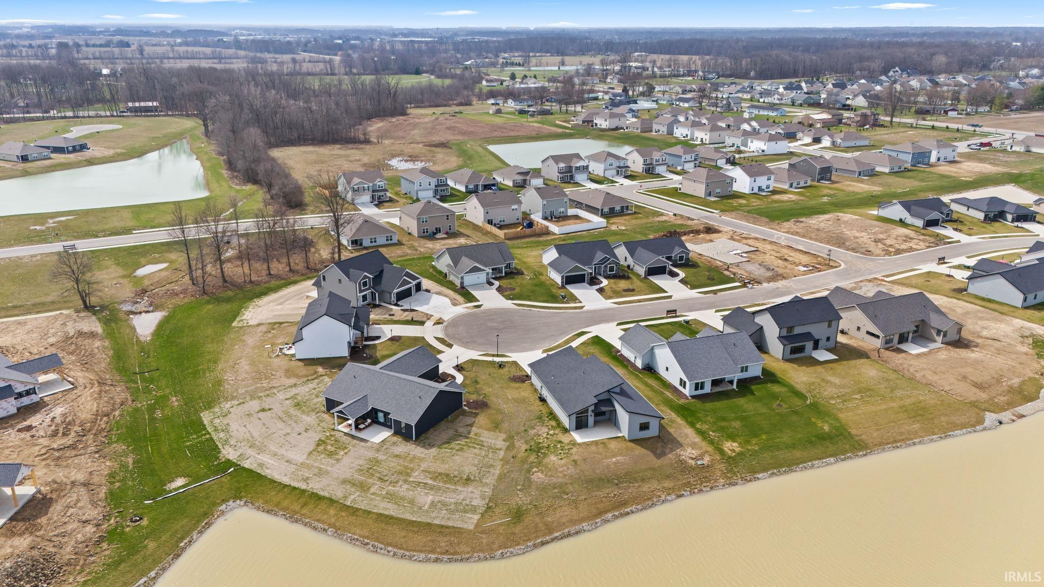 Aerial overview of property's location featuring nearby suburban area