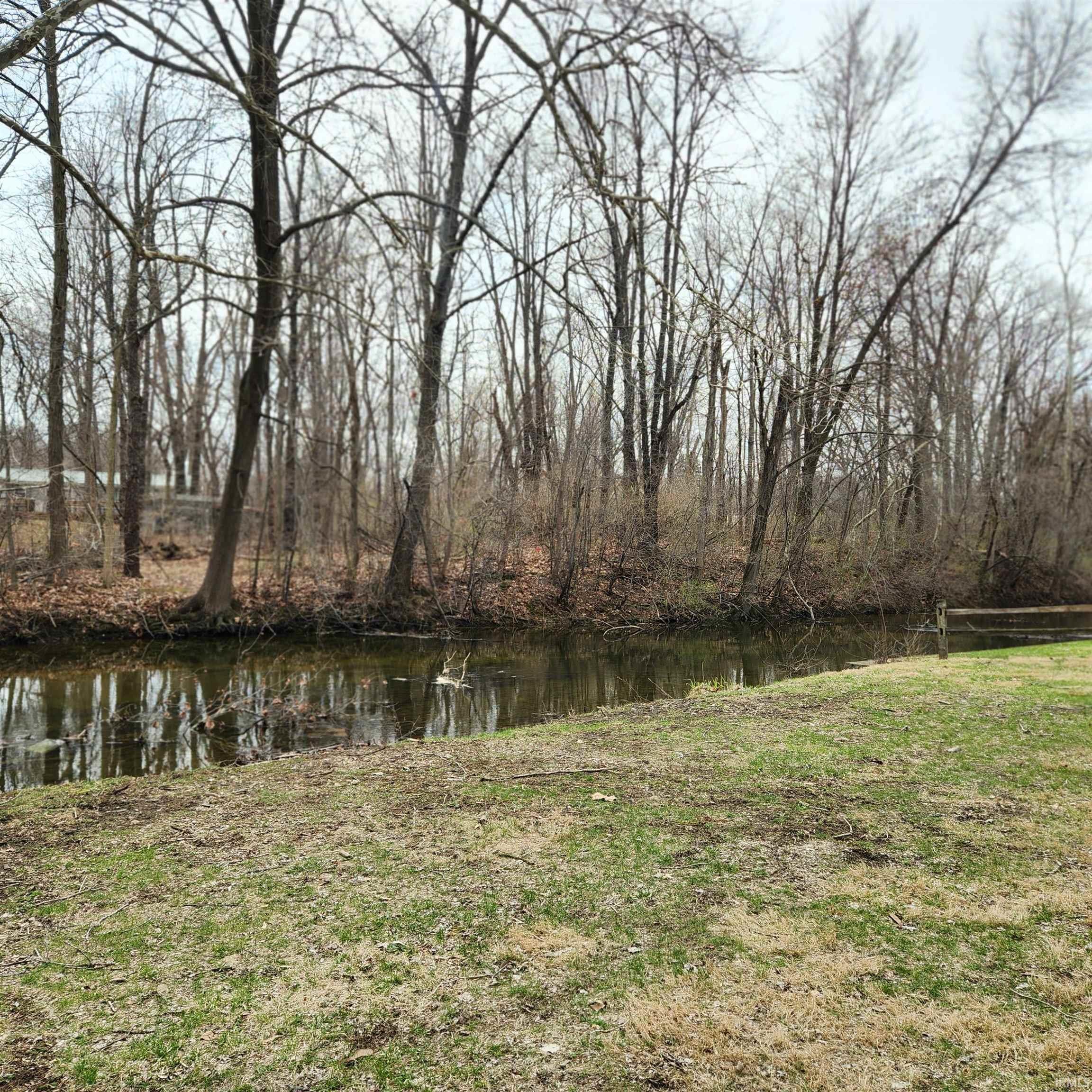 View of yard with a water view