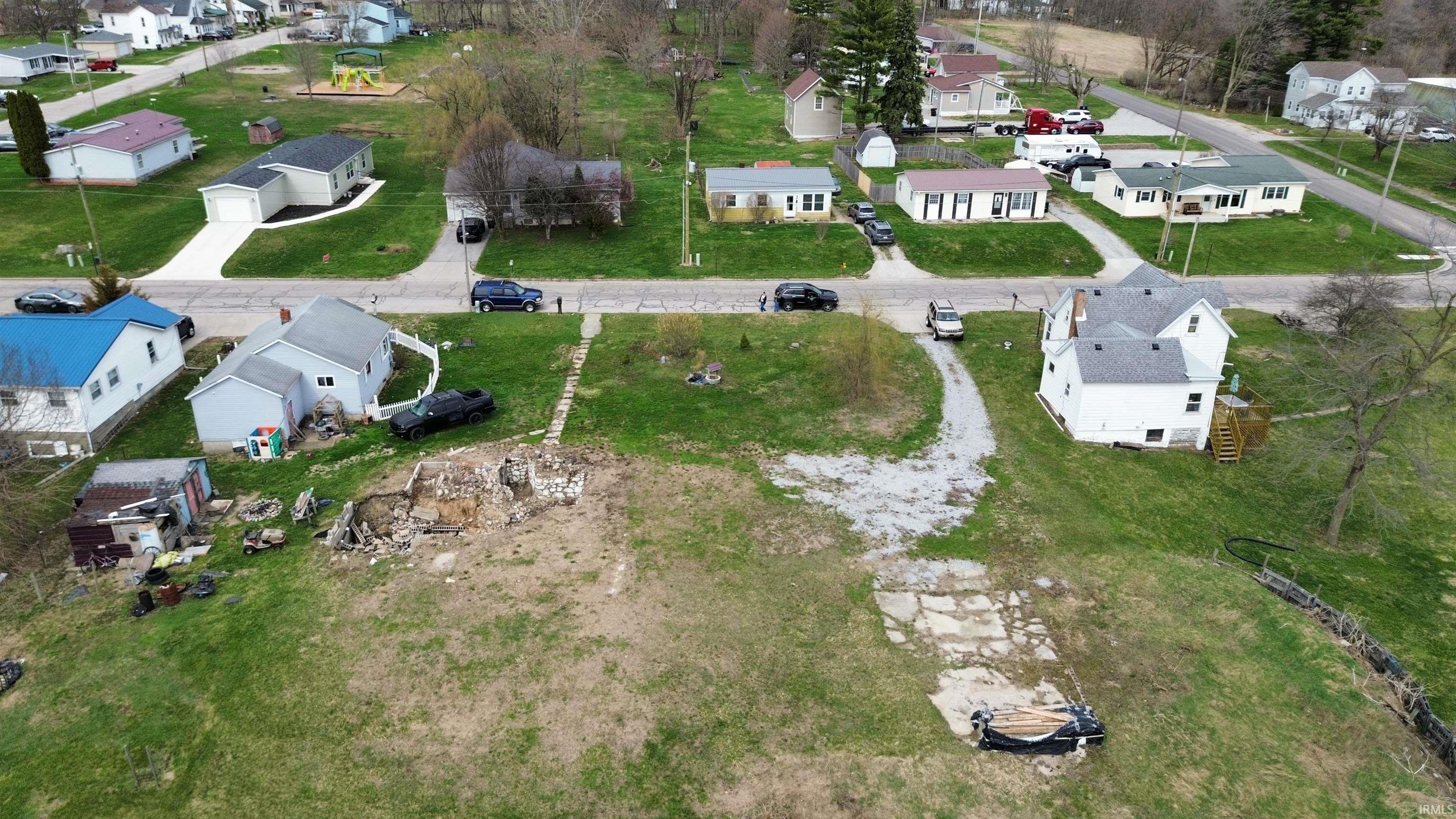 Aerial overview of property's location featuring nearby suburban area