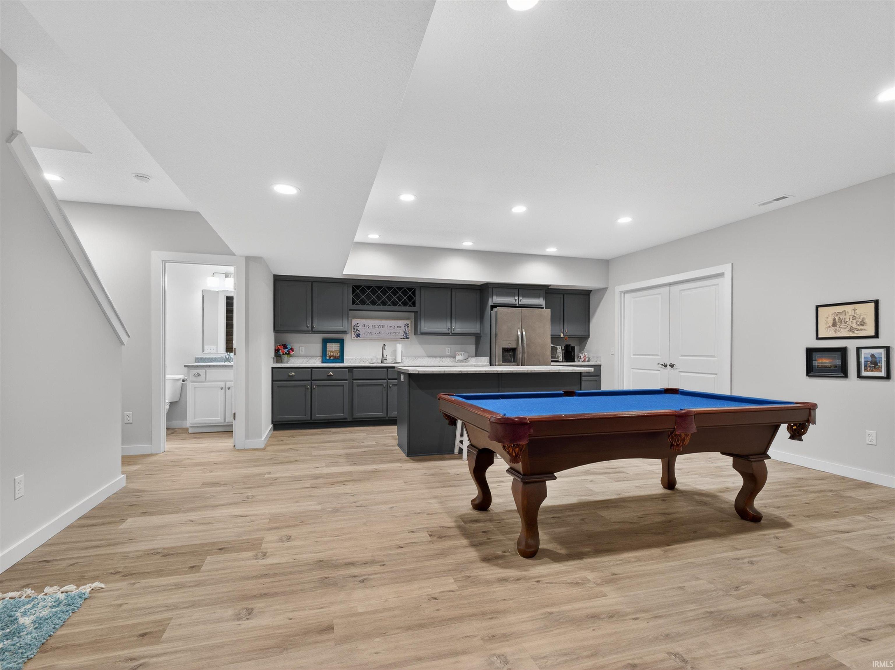 Rec room featuring billiards, light wood finished floors, and recessed lighting