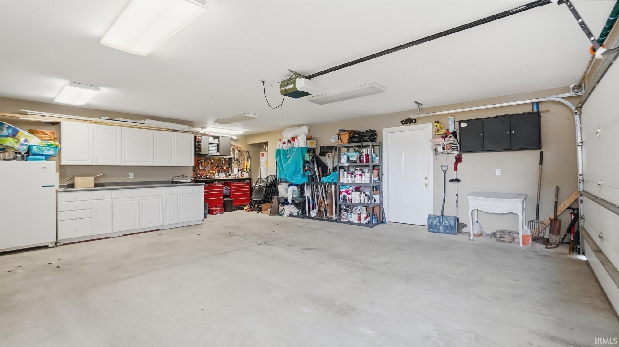 Garage featuring a garage door opener