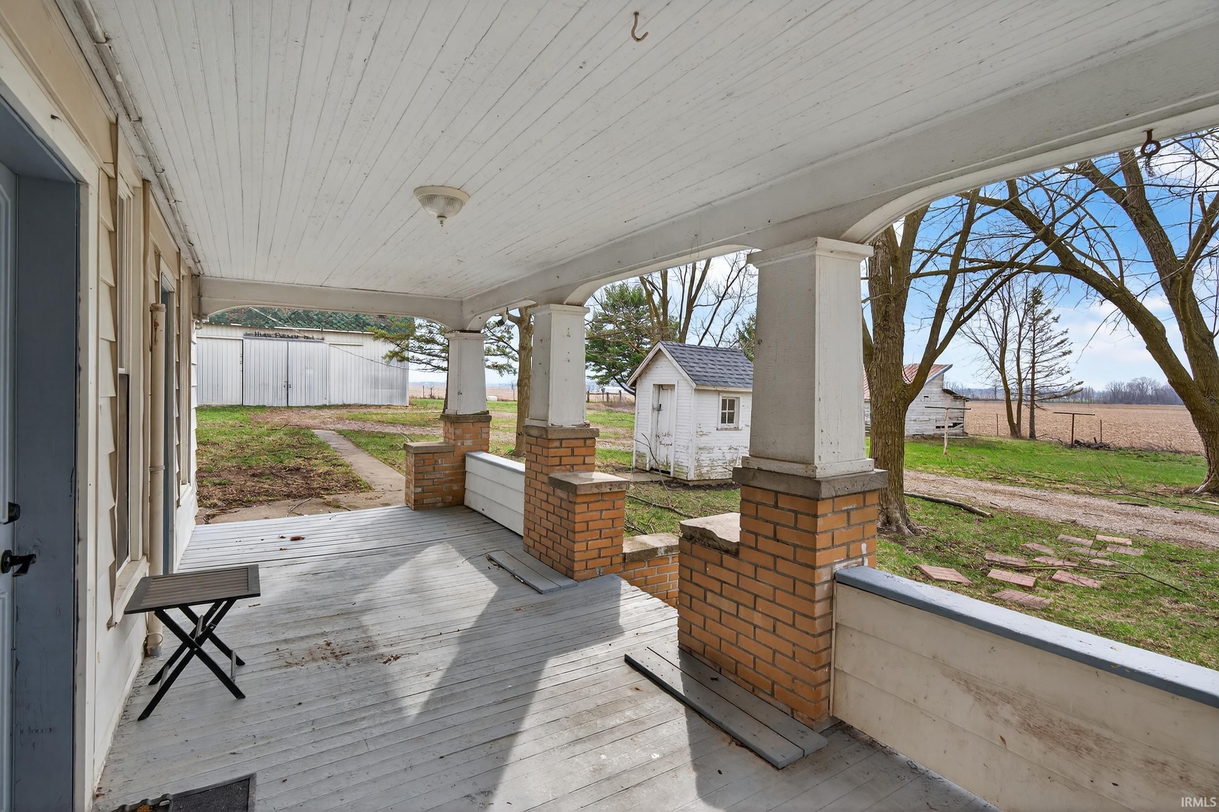 Porch featuring an outdoor structure