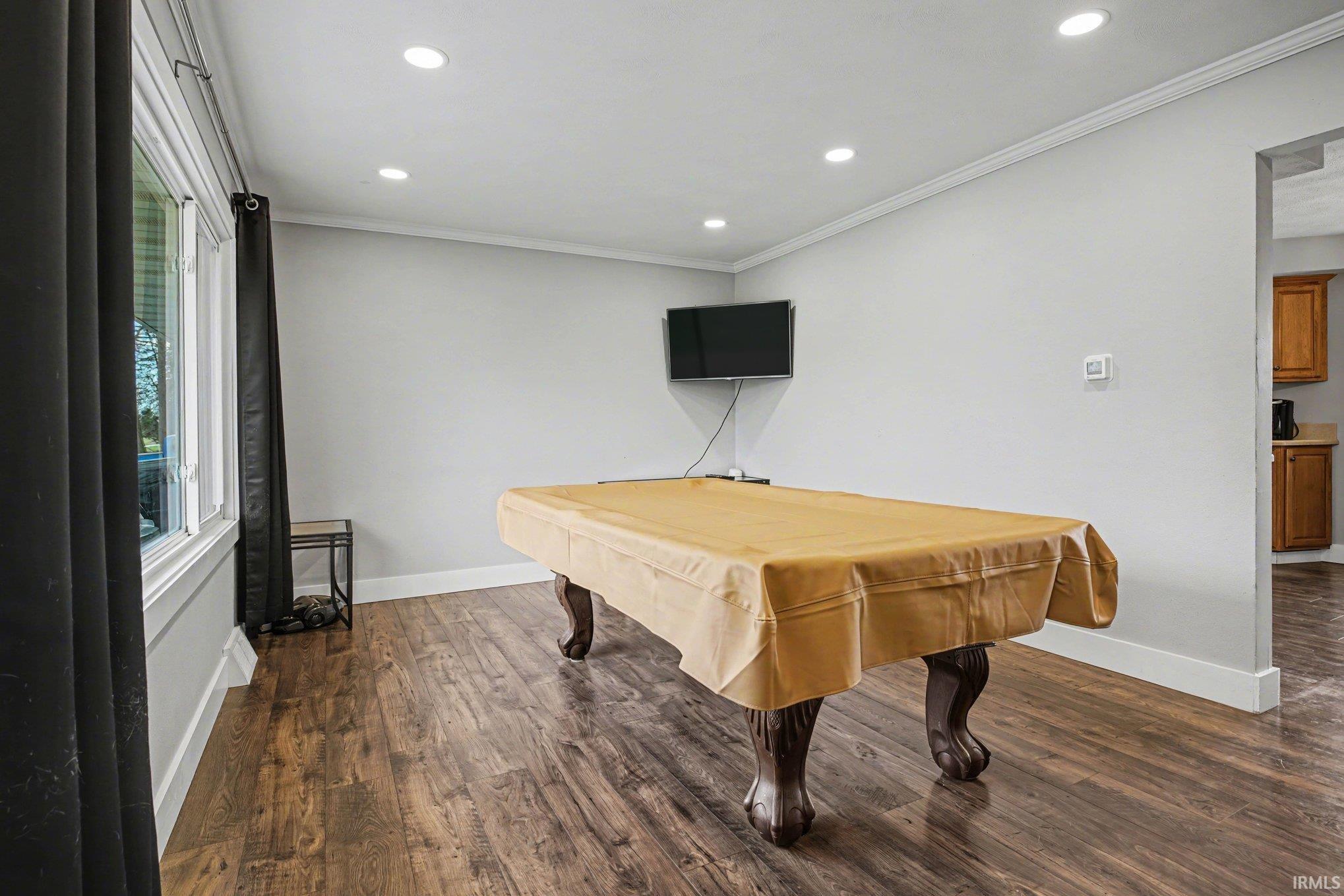 Recreation room with billiards, dark wood-style flooring, crown molding, and recessed lighting