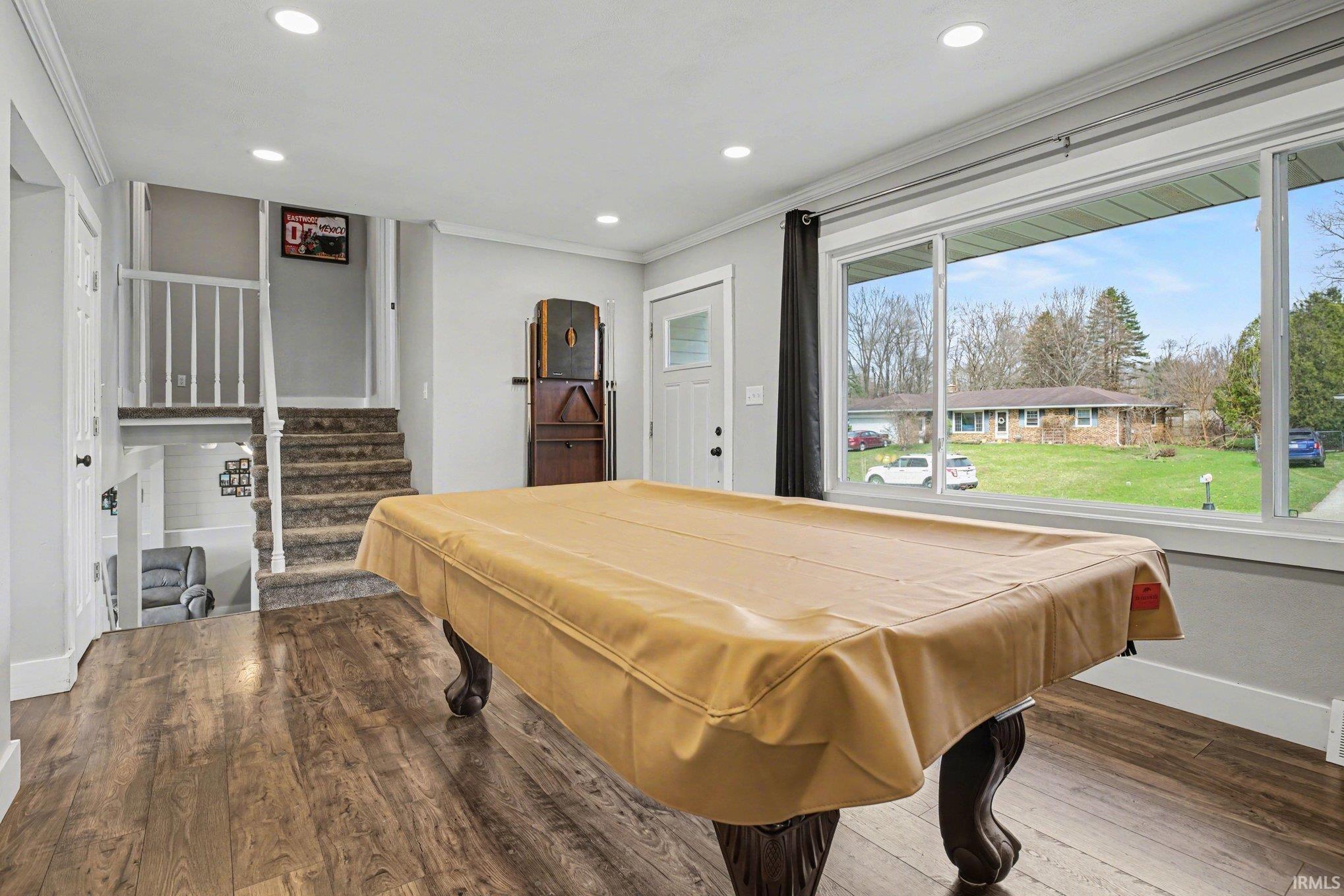 Rec room featuring dark wood-style flooring, ornamental molding, recessed lighting, and billiards