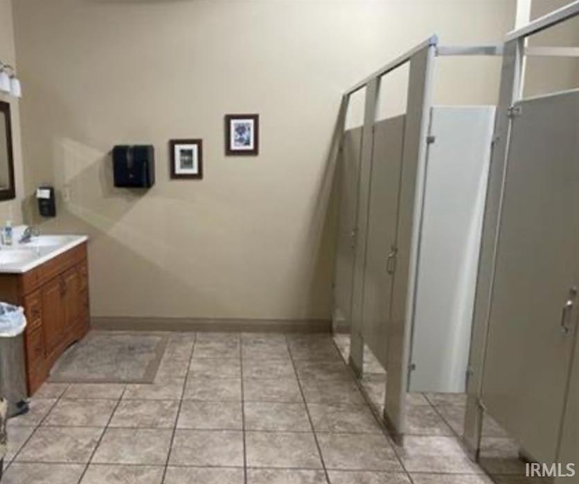 Bathroom featuring vanity and light tile patterned flooring