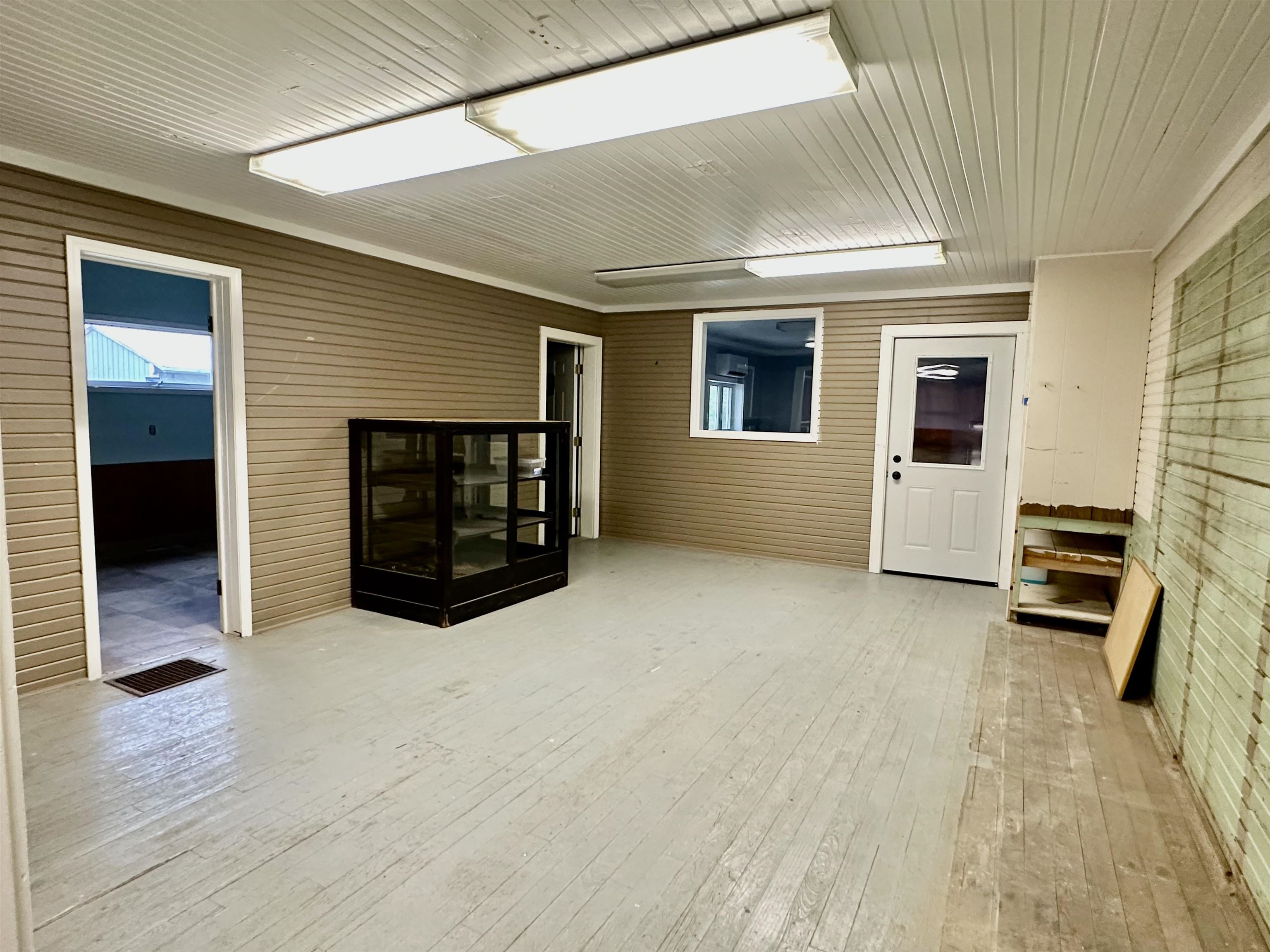 Empty room with light wood finished floors