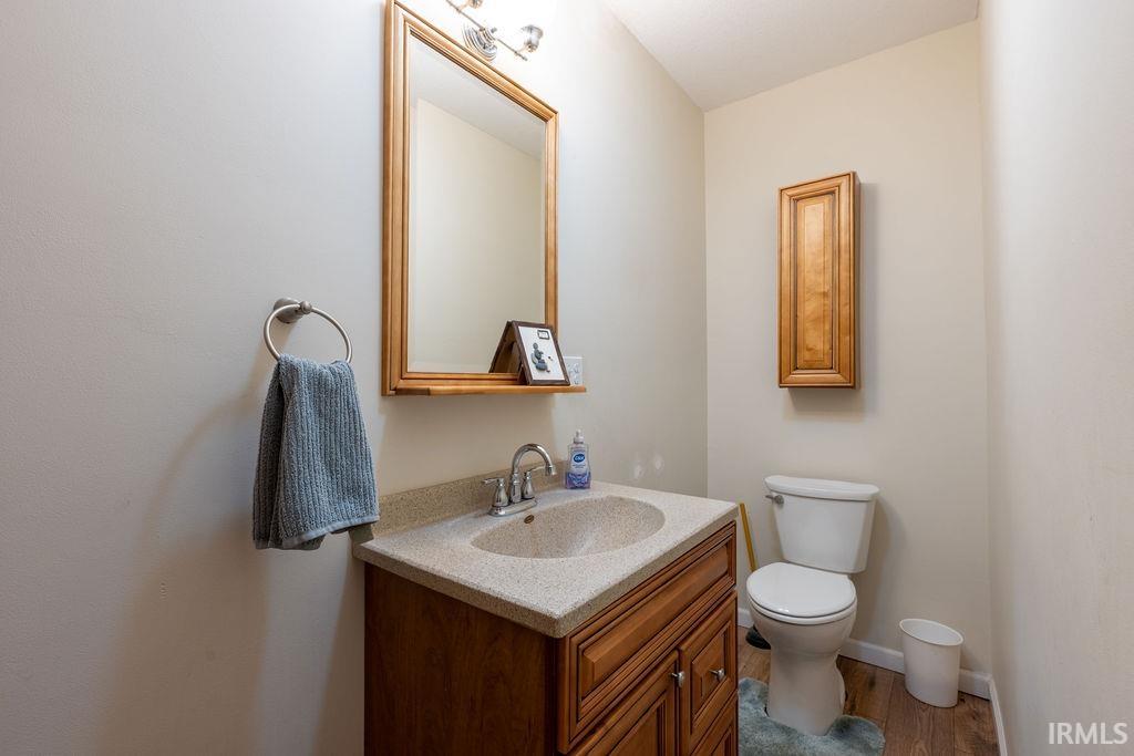 Bathroom with vanity and wood finished floors