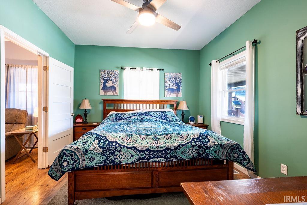Bedroom with light wood-style flooring and ceiling fan