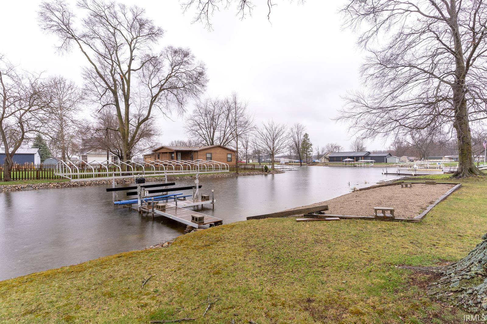 Dock area featuring a water view and a residential view