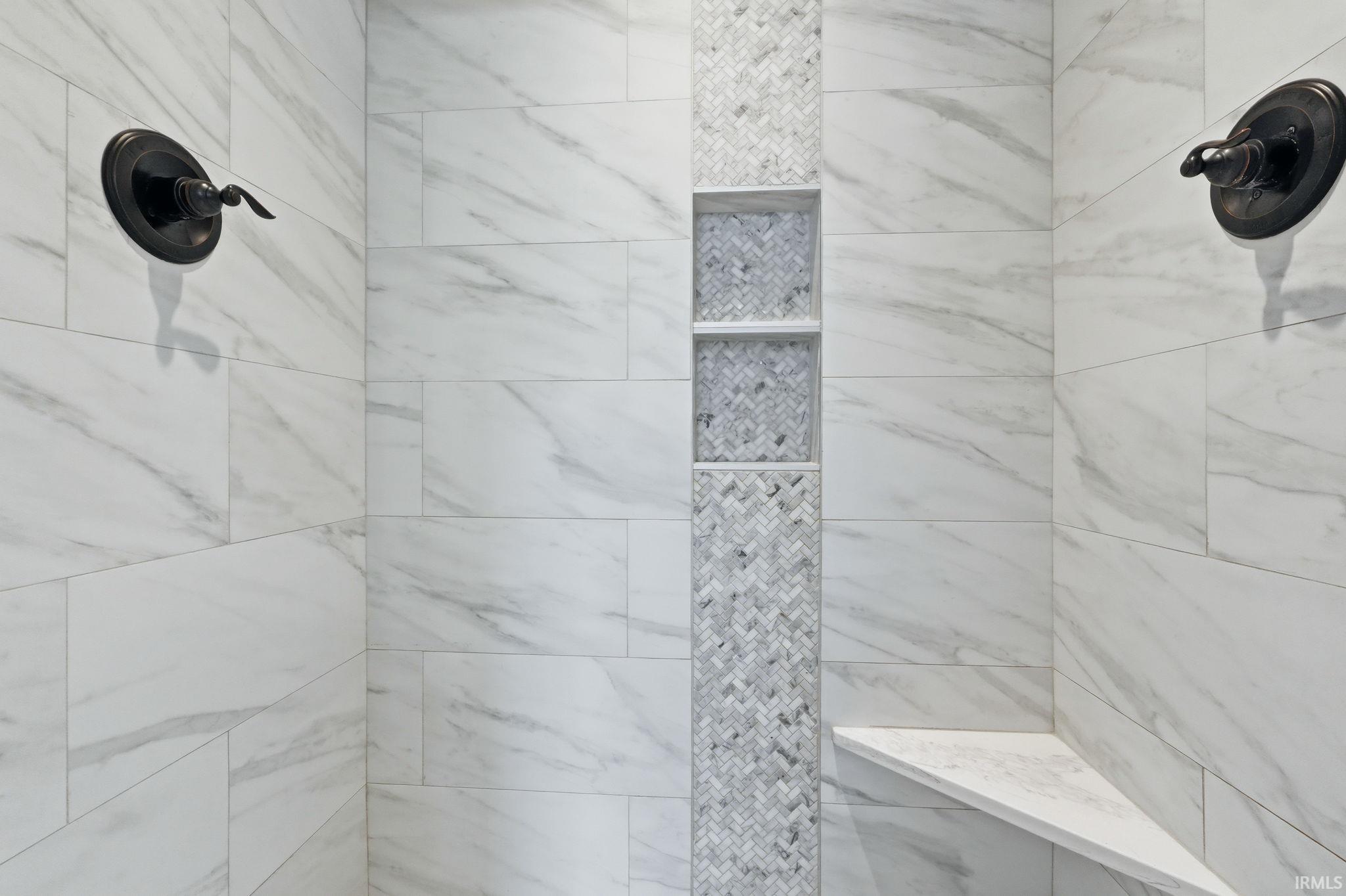 Full bathroom featuring tiled shower