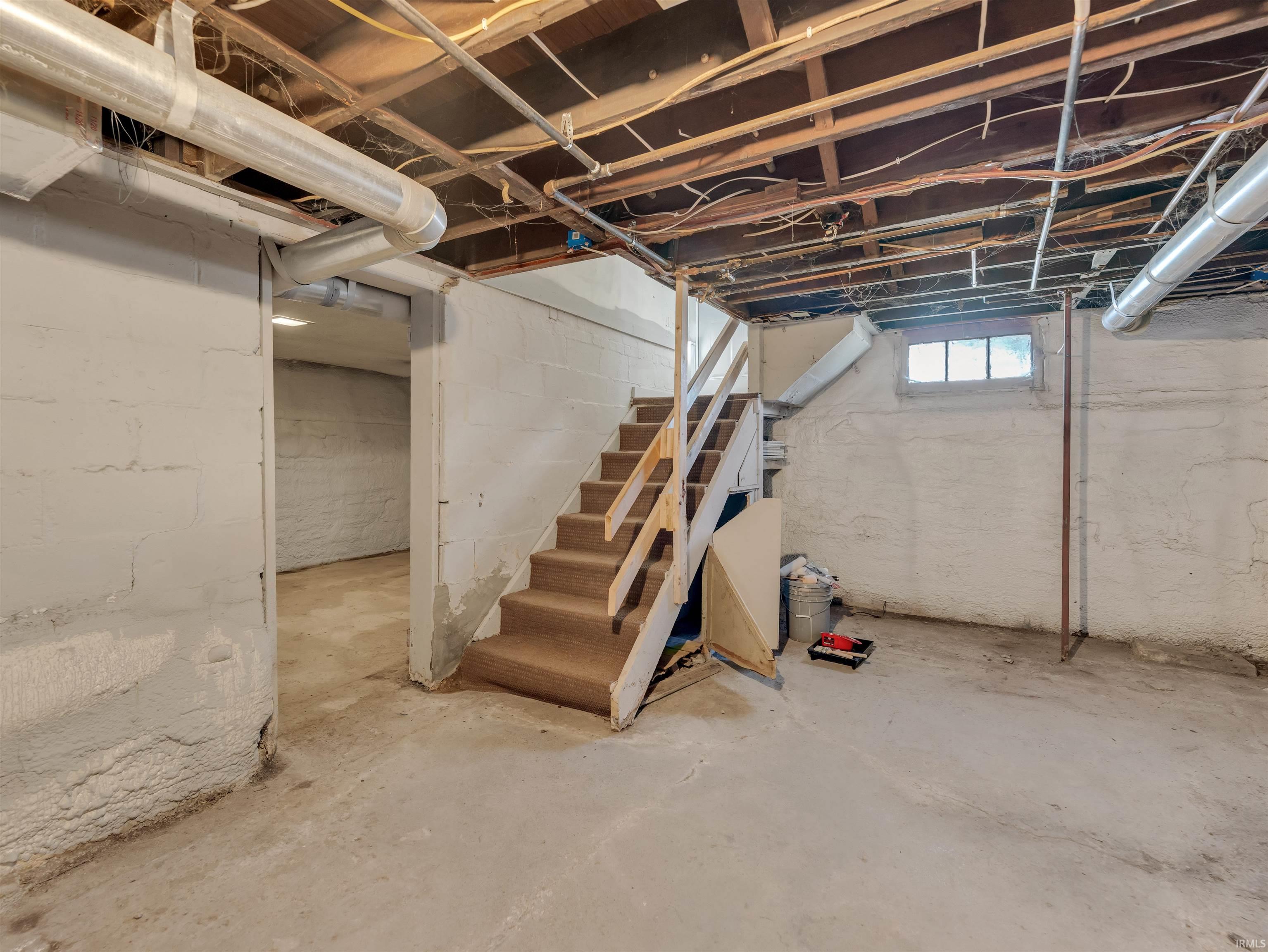 Basement featuring stairs